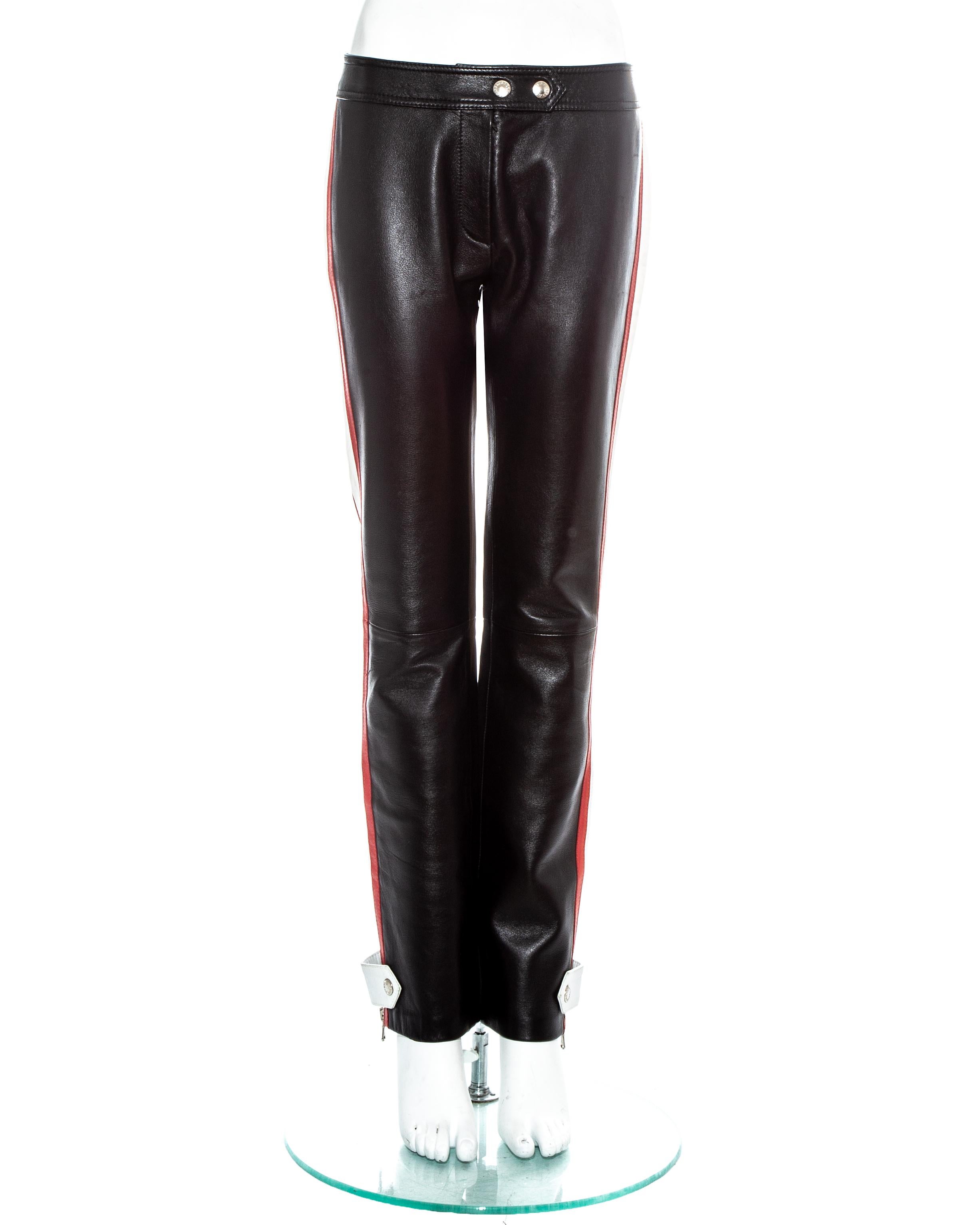 Dolce & Gabbana black leather biker pants with red and white striped panels on side and zip fastenings on ankles.

Spring-Summer 2001