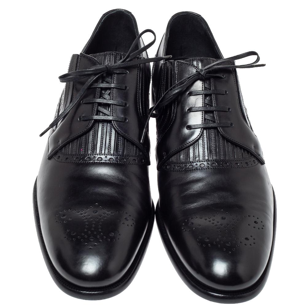 These derbies from Dolce & Gabbana are a must-have in your collection this season. Wear these impressive black shoes and be the center of attention at any event. Crafted from quality leather, they are styled with brogue detailing, lace-up vamps,