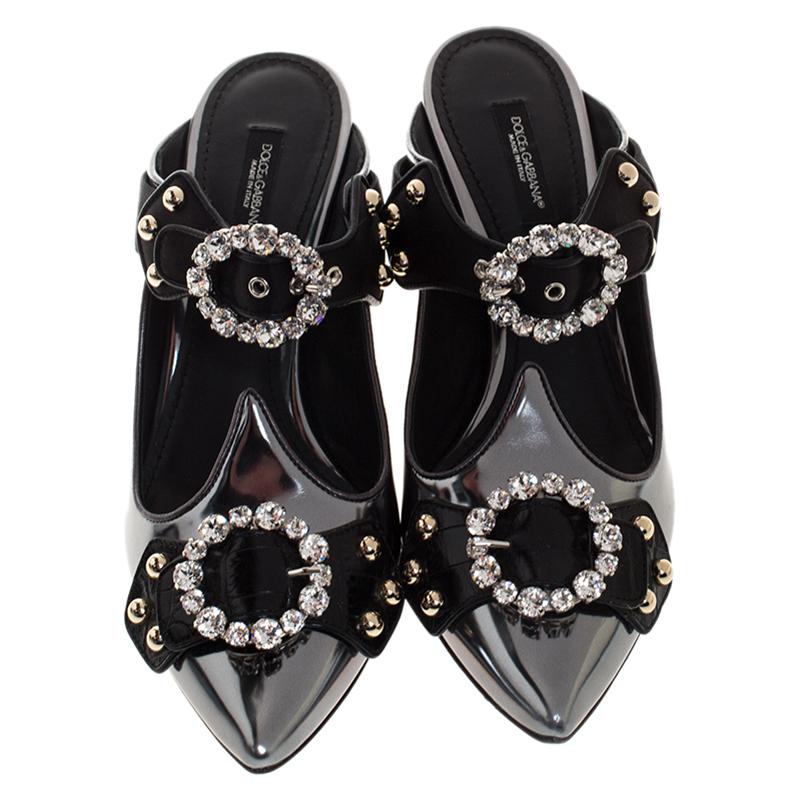 These sandals coming from the fashion house of Dolce & Gabbana showcase a versatile and feminine look. Crafted from leather and satin, they are highlighted with embellished buckles and pointed toes. The striking pair is set on 7.5 cm