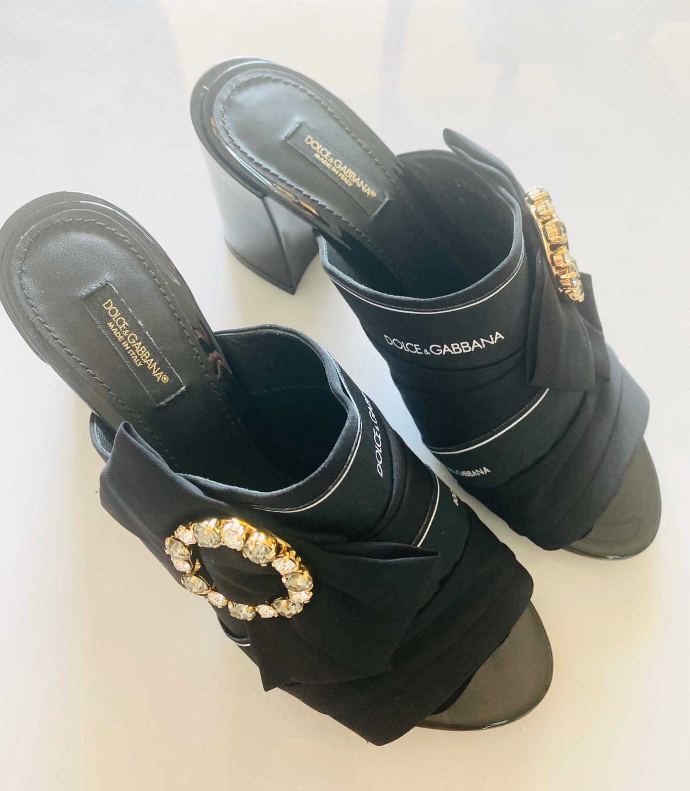 Dolce & Gabbana Black Crystals embellished Logo cloth leather  heels slip on shoes sandals

Size 38,5 UK5,5 

Brand new with the original box! 

Please check my other DG clothing, beachwear, shoes, bags and accessories!
