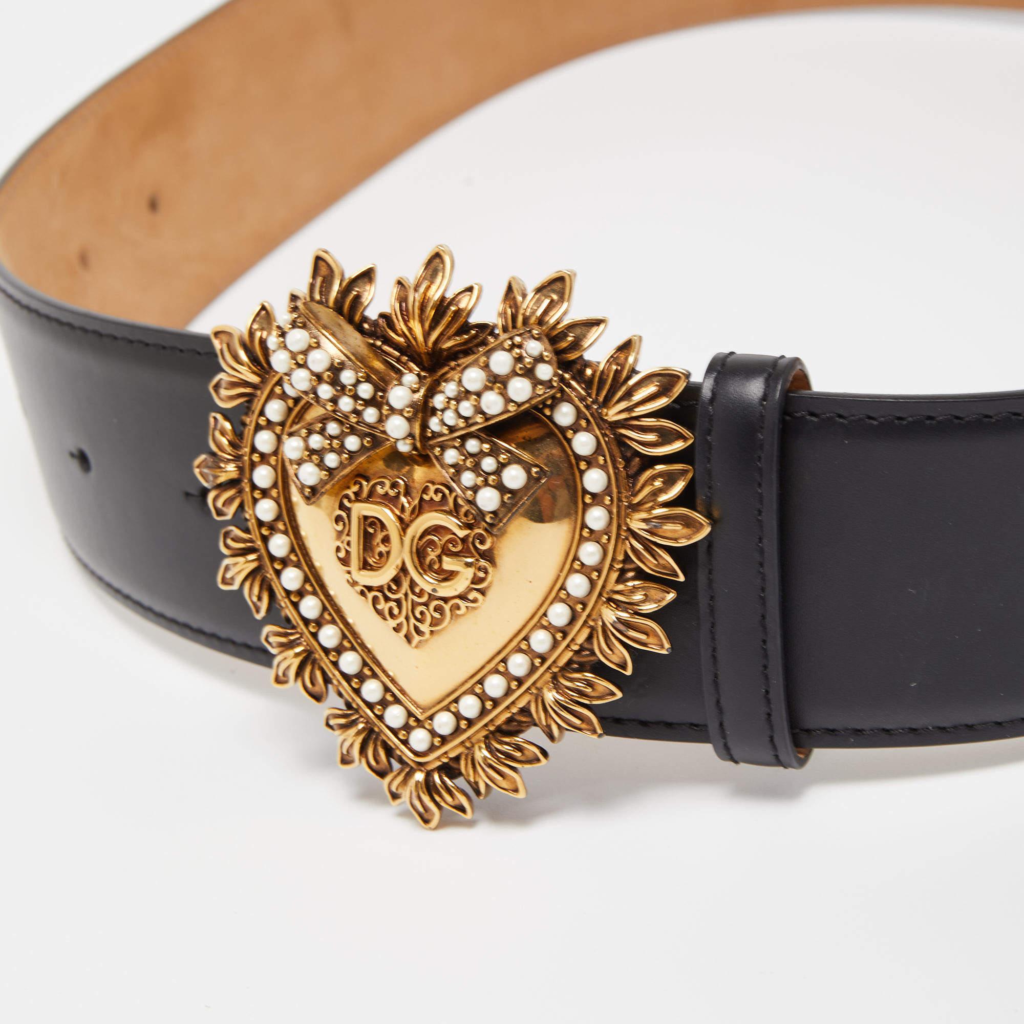 This Dolce & Gabbana belt has a magnificent Devotion heart buckle in gold-tone metal embellished with crystals. Crafted from durable black leather, the belt has a single loop and it will easily add a luxe touch to your ensemble.

