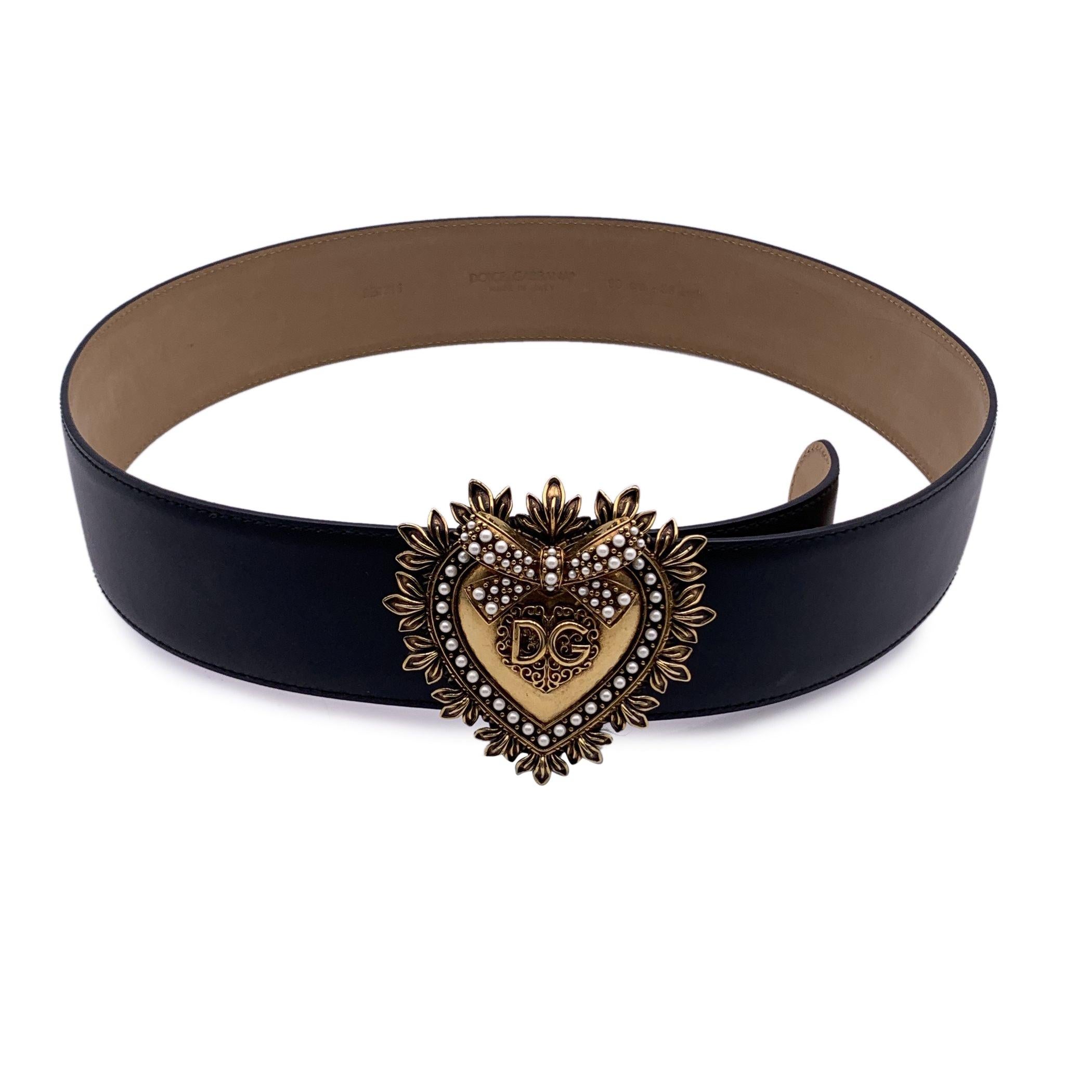 Dolce & Gabbana Devotion belt in Black lux leather with beautiful gold metal logo jeweled heart buckle with pearl inlays. Height: 2 inches - 5.1 cm. Mushroom closure under buckle. 5 holes adjustment. Size 90 cm / 36 Inches. Retail price is €695