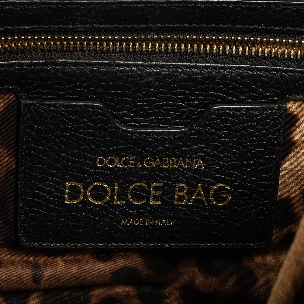 A fine choice of a leather bag is this Dolce Box from Dolce & Gabbana. The bag has a fabric-lined interior, a top handle, shoulder strap, and gold-tone hardware. It will make a prized buy as it will last you for many years.

