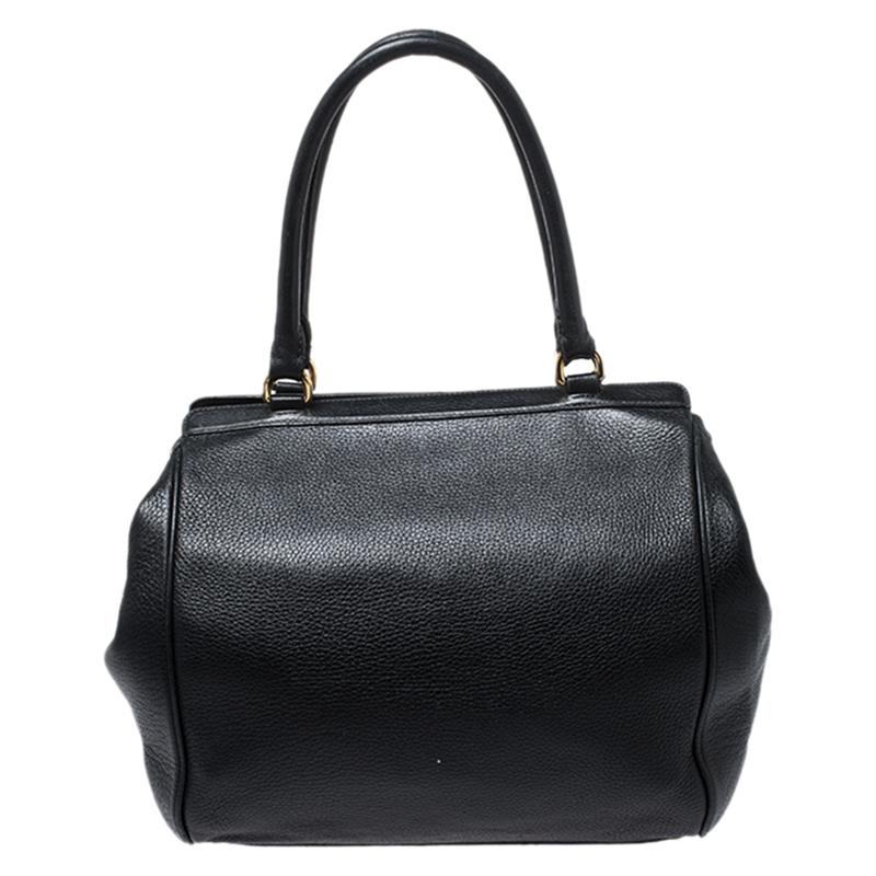 A versatile accessory, you can use this black leather bag for multiple occasions. The fabric lining ensures the standard of this bag. It has gold-tone hardware, flap closure and two top handles. This flap satchel is by Dolce&Gabbana.

Includes:
