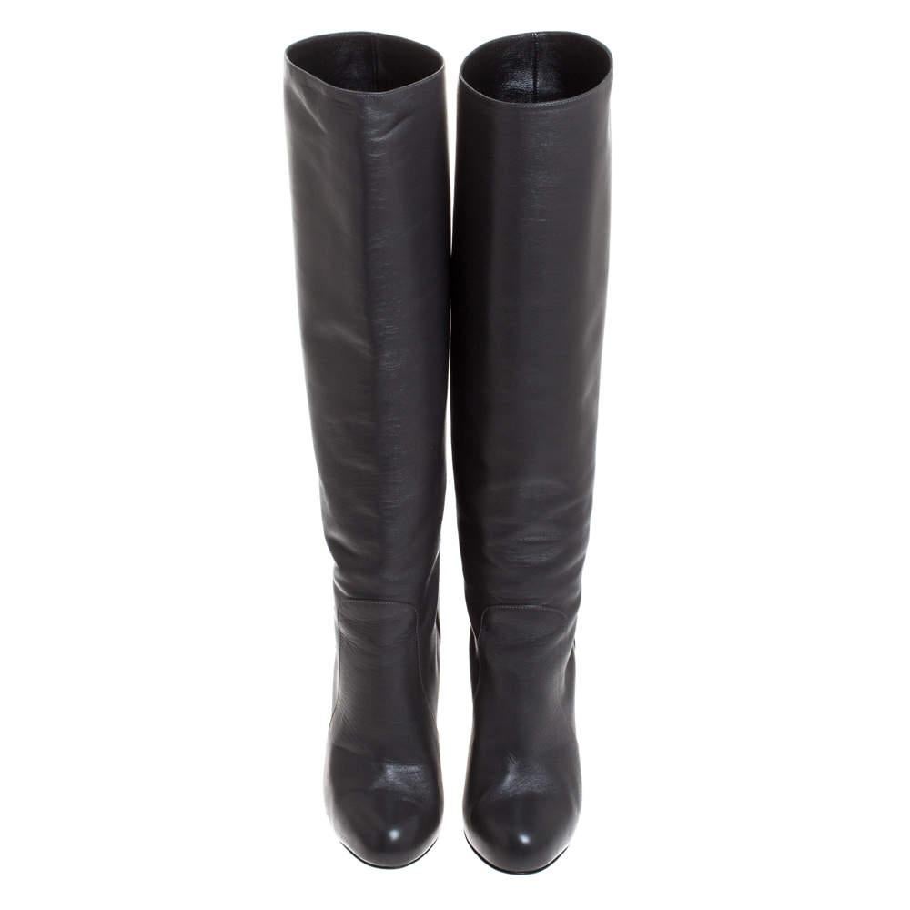 Creations as fashionable as this pair of knee-length boots from Dolce & Gabbana deserves to be in every woman's closet. They've been created from leather and designed with covered toes and 12 cm heels.

