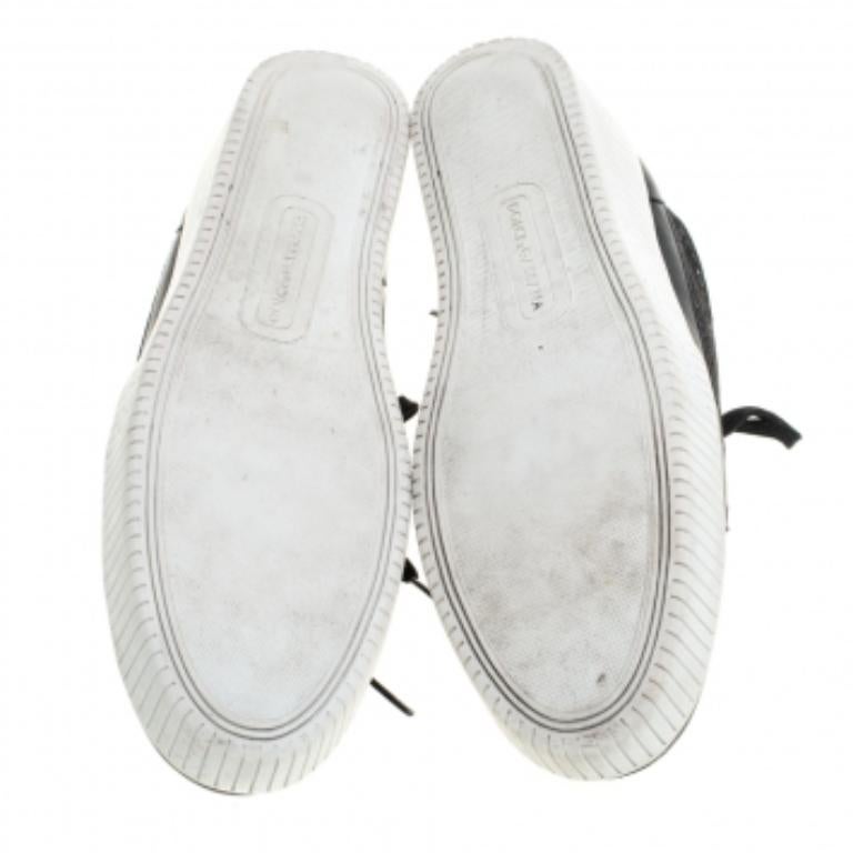 Undeniably stylish and chic, these graceful Dolce & Gabbana sneakers are a must-have. Fashioned in leather, they feature delicate floral lace that adds a feminine appeal to the sporty kicks. These black sneakers will instantly lend you a dressy look