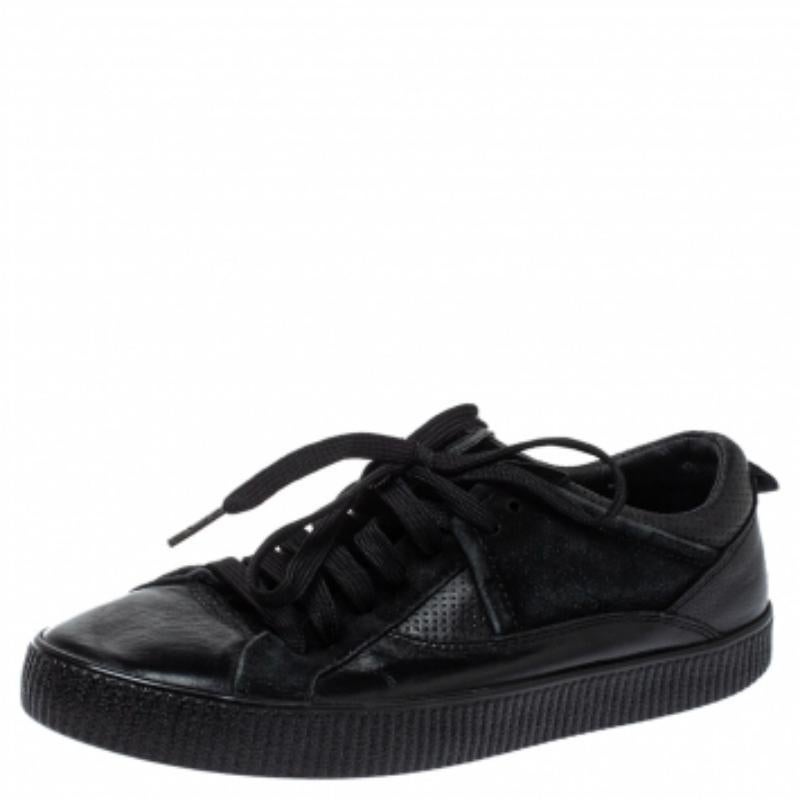These low top sneakers from Dolce and Gabbana are rendered in black leather and flaunt round toes, lace-ups on the vamps, and brand details on the counters. You will definitely steal a lot of stares when you step out in these comfortable sneakers.