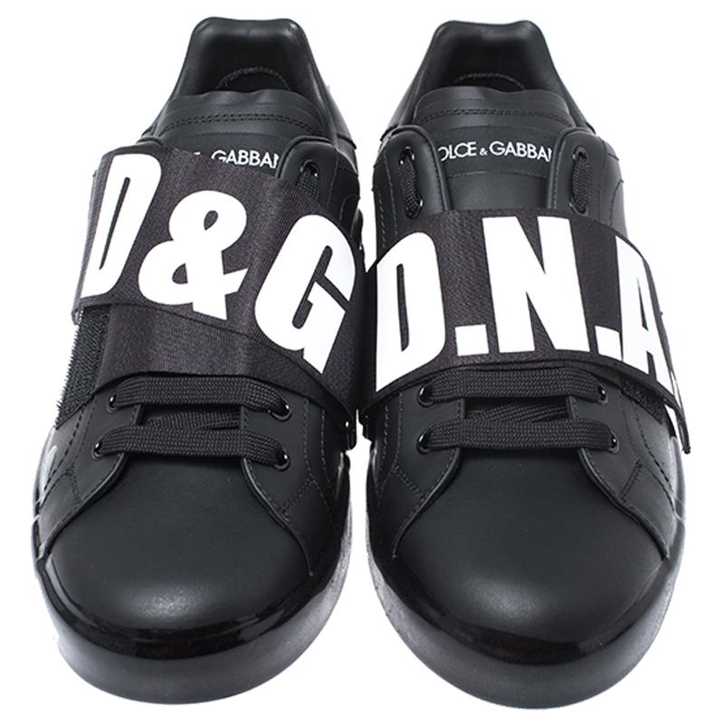 Enjoy footwear ease with this pair of sneakers by Dolce&Gabbana. They've been crafted from black leather and designed with lace-ups and velcro logo straps on the uppers. Lined with leather, the sneakers are easy to slip on and off.

Includes: