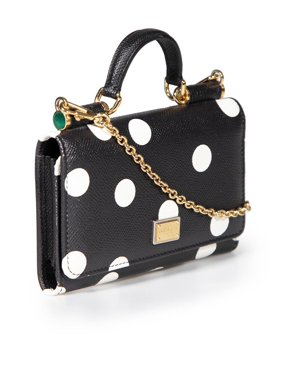 CONDITION is Very good. Minimal wear to bag is evident. Minimal wear to the front and back edging with white marks on this used Dolce & Gabbana designer resale item.
 
 
 
 Details
 
 
 Sicily Von
 
 Black
 
 Leather
 
 Wallet on chain
 
 Polkadot
