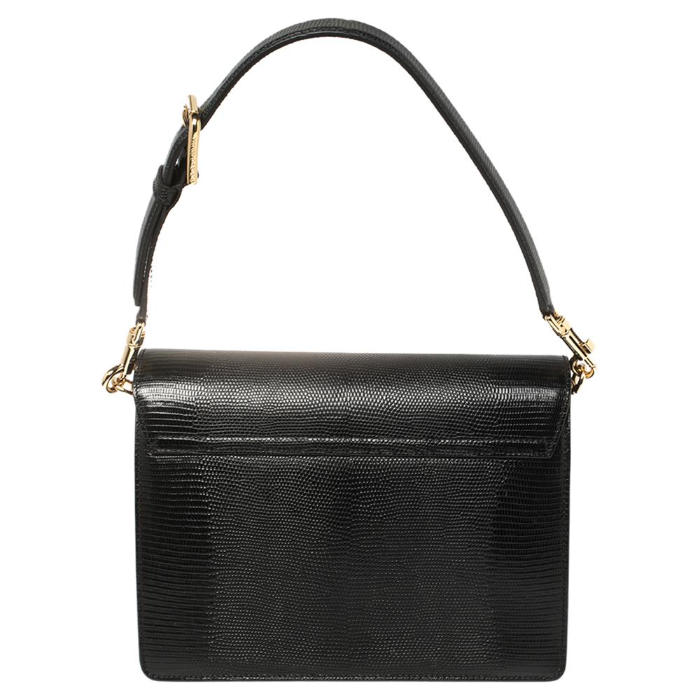 Make a stylish appearance by adorning this gorgeous lizard-embossed leather bag. It has a 21 cm top handle and a long 55 cm shoulder strap—both adjustable and detachable. The leather-lined interior helps you keep your valuables intact without losing