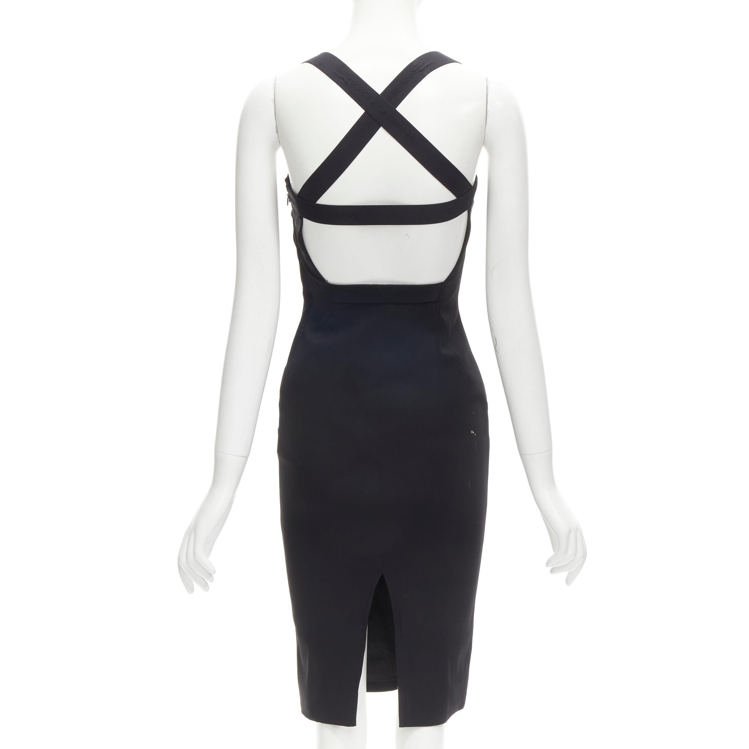 DOLCE GABBANA black logo elastic strap cross back bodycon dress IT36 XS
Brand: Dolce Gabbana
Extra Detail: DOLCE & GABBANA logo intarsia elastic shoulder straps. Padded bust. Cut out window at back. Center back vent.

CONDITION:
Condition: Very
