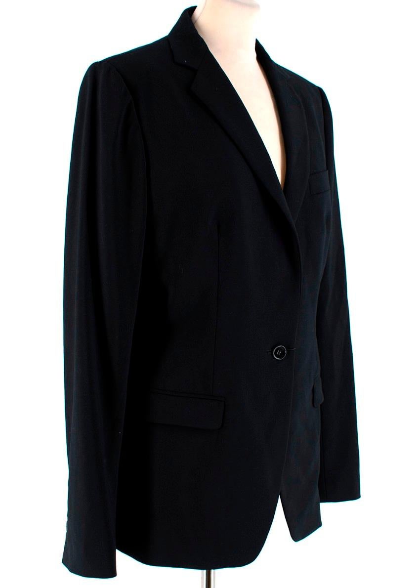 Dolce & Gabbana Black Martini Two Piece Suit 

Blazer:
- Sealed front flap pockets 
- Cuff button fastenings 
- Sealed slip front pocket
- Front button fastening 

Trousers:
- Button and zip fastening 
- Belt loops 
- Slip pockets 

Materials:
Main