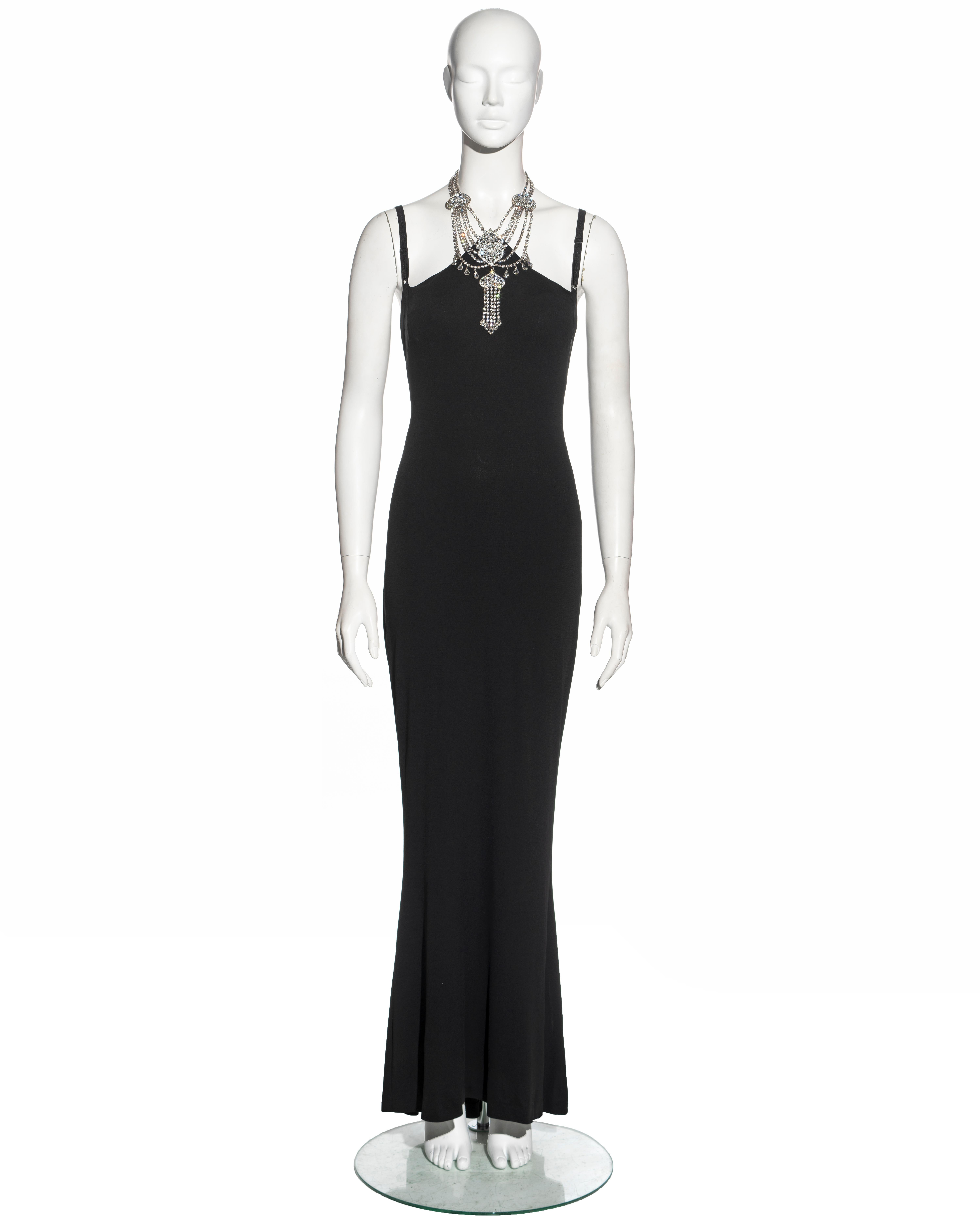▪ Dolce & Gabbana evening dress
▪ Sold by One of a Kind Archive
▪ Constructed from black rayon and spandex jersey 
▪ Built-in silk bra with adjustable shoulder straps
▪ Integrated crystal choker necklace 
▪ Ruched seam on the centre-back seam 
▪
