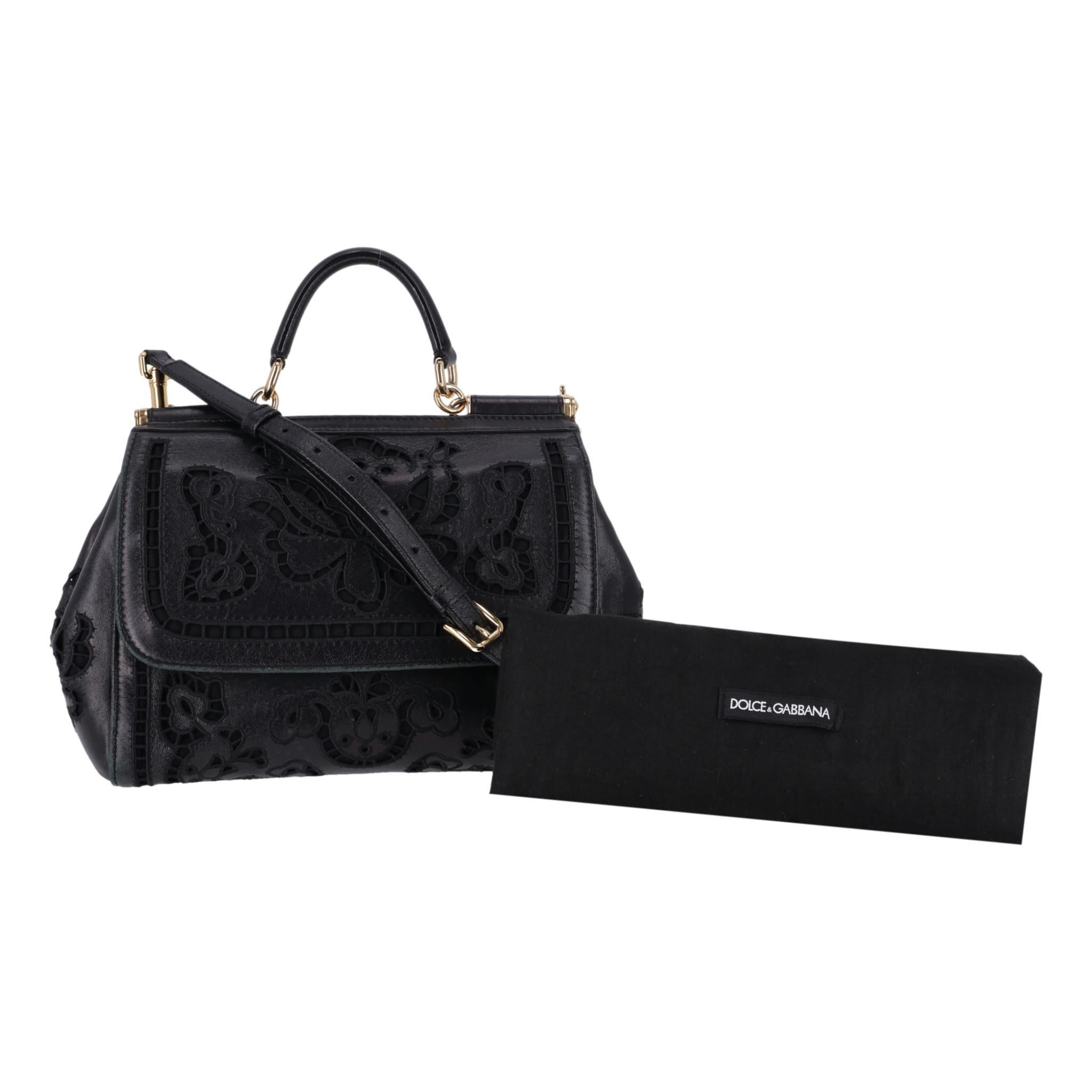 Dolce & Gabbana Black Miss Sicily Floral Embroidered Leather Bag

Black Miss Sicily bag crafted from leather with floral laser-cur embroidery.

Gold, branded hardware, top leather handle and detachable, adjustable shoulder strap.

Front magnetic
