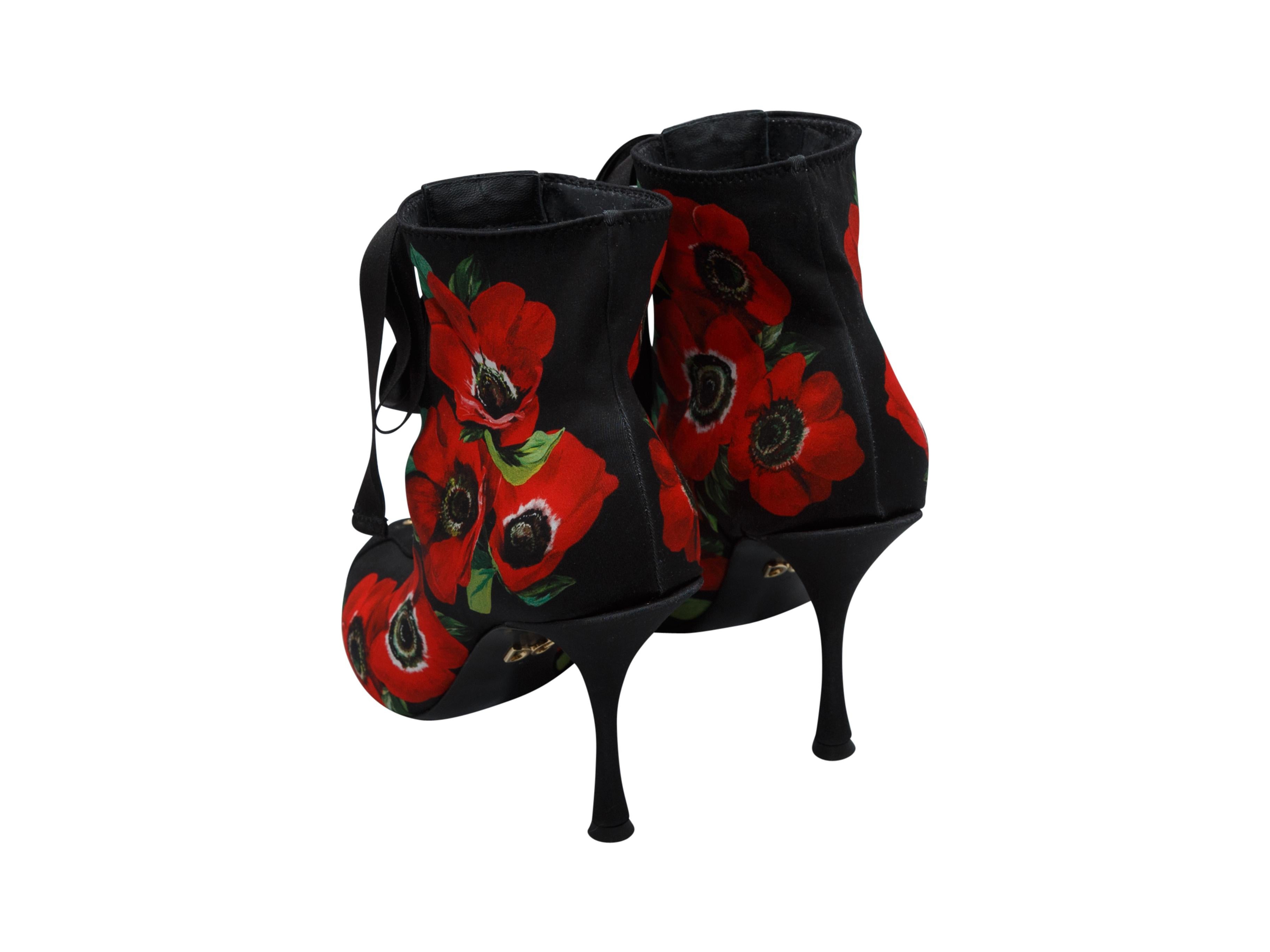 Product details: Black and multicolor satin peep-toe booties by Dolce & Gabbana. Floral print throughout. Lace-up closure at tops. Designer size 39.5.
Condition: Pre-owned. Very good.