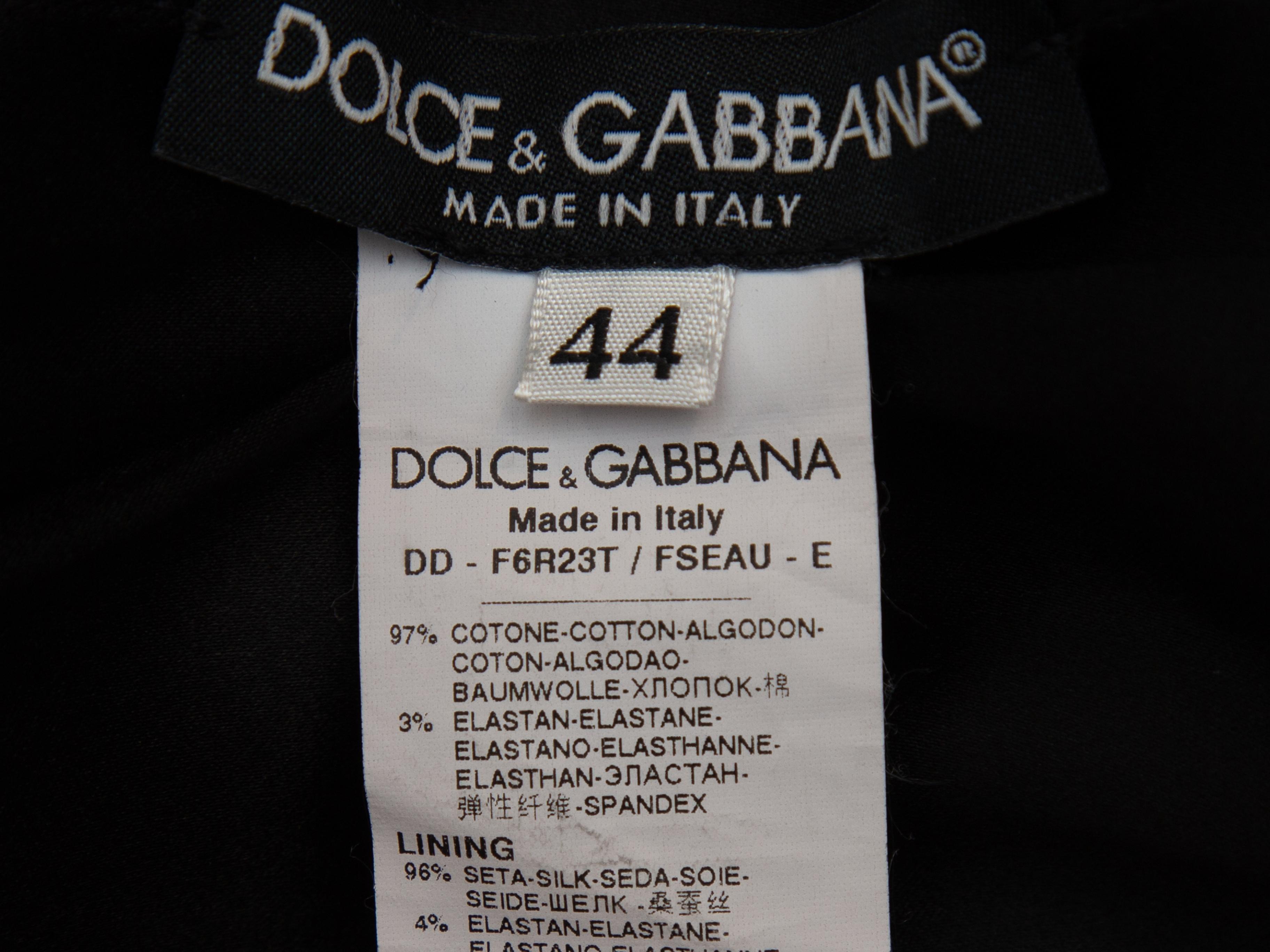 Product details: Black and multicolor floral print dress by Dolce & Gabbana. Surplice neckline. Ruching at waist. Zip closure at center back. Designer size 44. 34