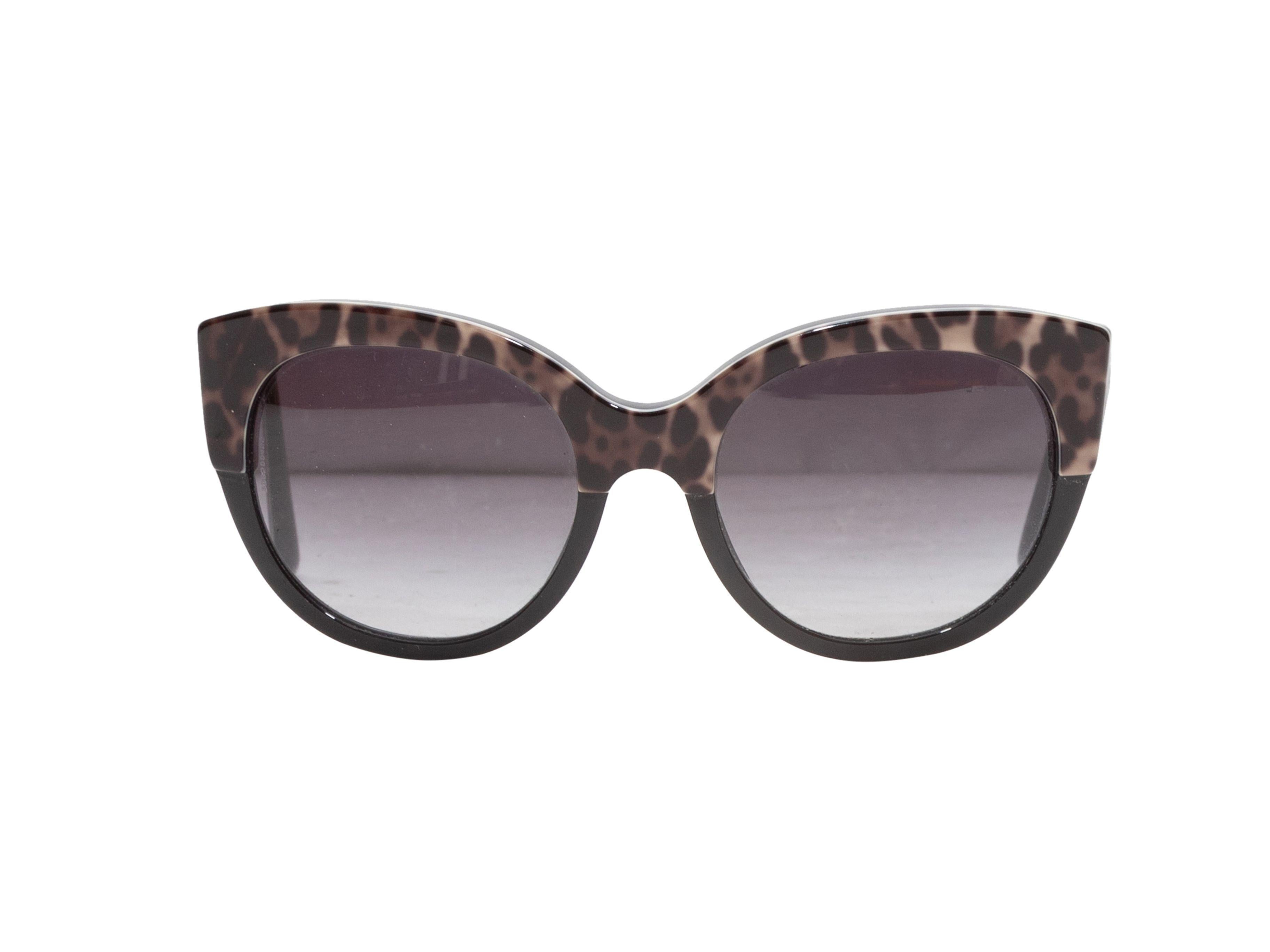 Product Details: Black and multicolor leopard print acetate sunglasses by Prada. Grey tinted lenses. 5.5