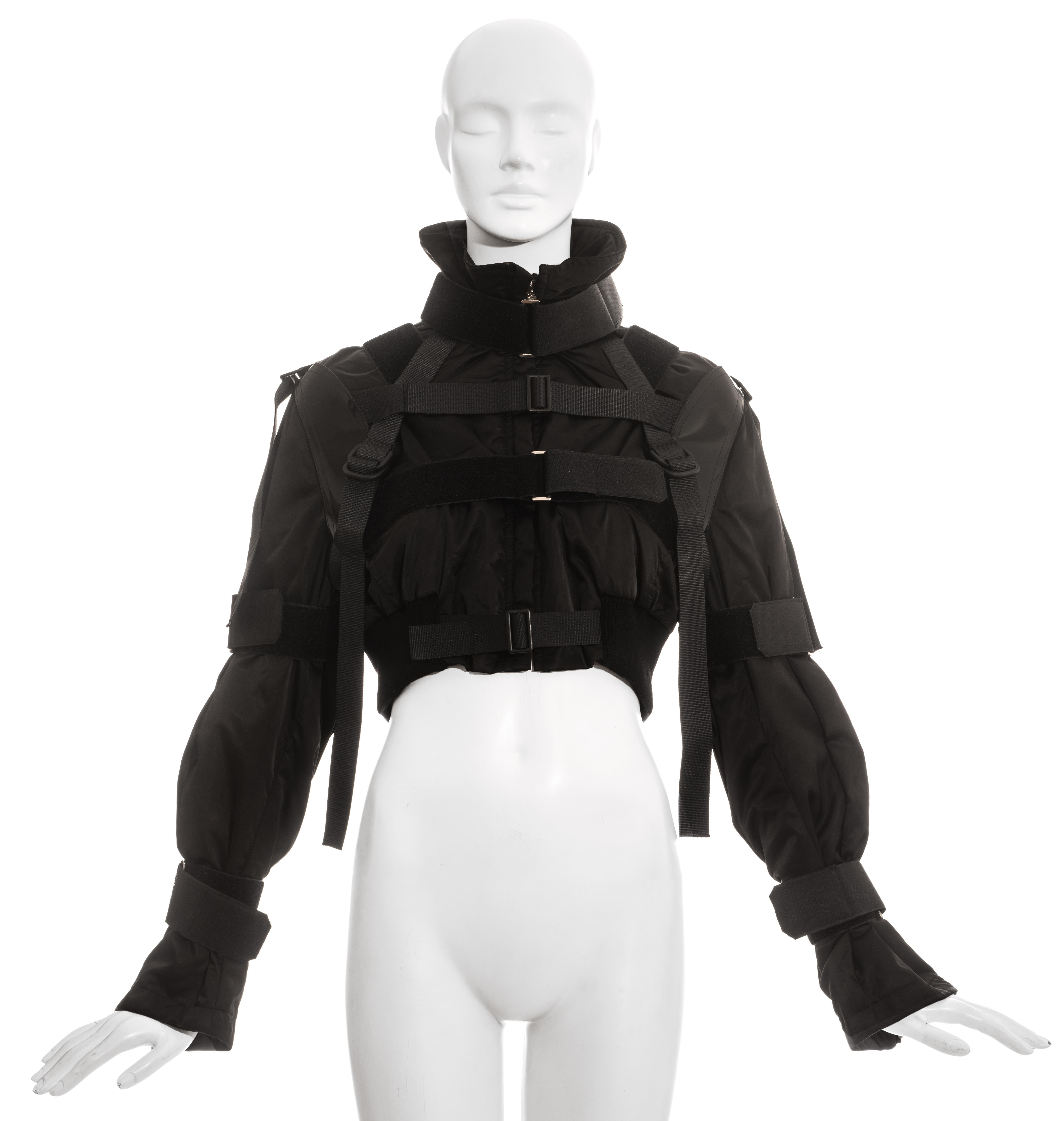 Dolce & Gabbana black nylon cropped parachute bomber jacket with multiple velcro bondage style fastenings.

Fall-Winter 2003