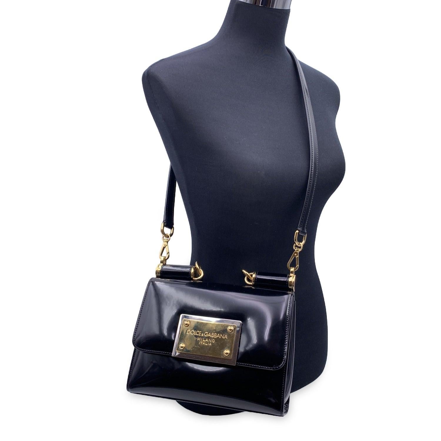 This beautiful Bag will come with a Certificate of Authenticity provided by Entrupy. The certificate will be provided at no further cost. Black patent leather '90s Sicily' shoulder bag from DOLCE & GABBANA. The bag features gold metal hardware,