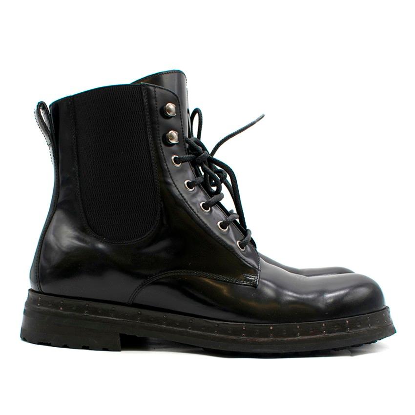 Dolce & Gabbana Black Patent-Leather Boots.

- Rubber track sole
- Elasticated side cutouts 
- Lace-up & hook front fastening 
- Rounded toe
- Leather loop hole on the back 
- Nailed pinned mid-sole

Approx:

Length: 31cm
Width: 12cm
Height: