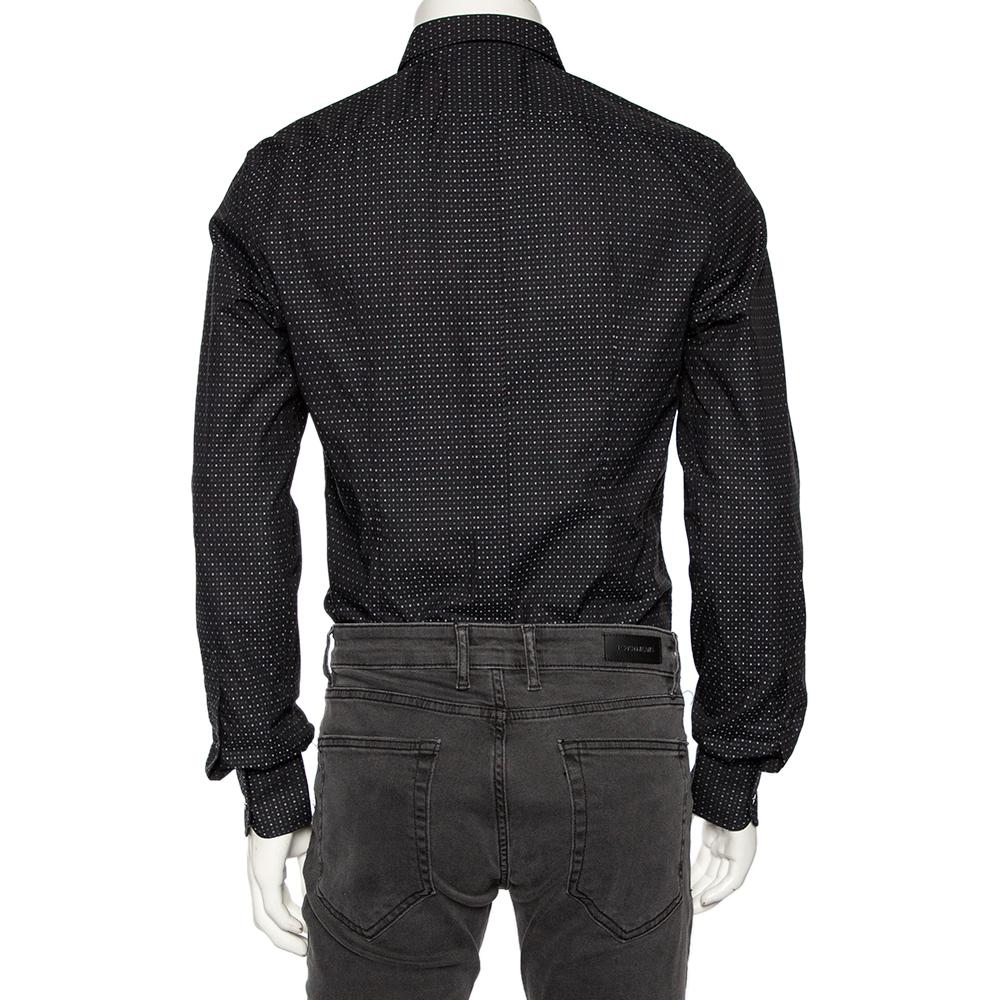 Shirts are an indispensable part of a man's wardrobe, so Dolce & Gabbana brings you a creation that is both versatile and stylish. It has been tailored from cotton in a black shade. The shirt is detailed with intricate patterns and long sleeves.

