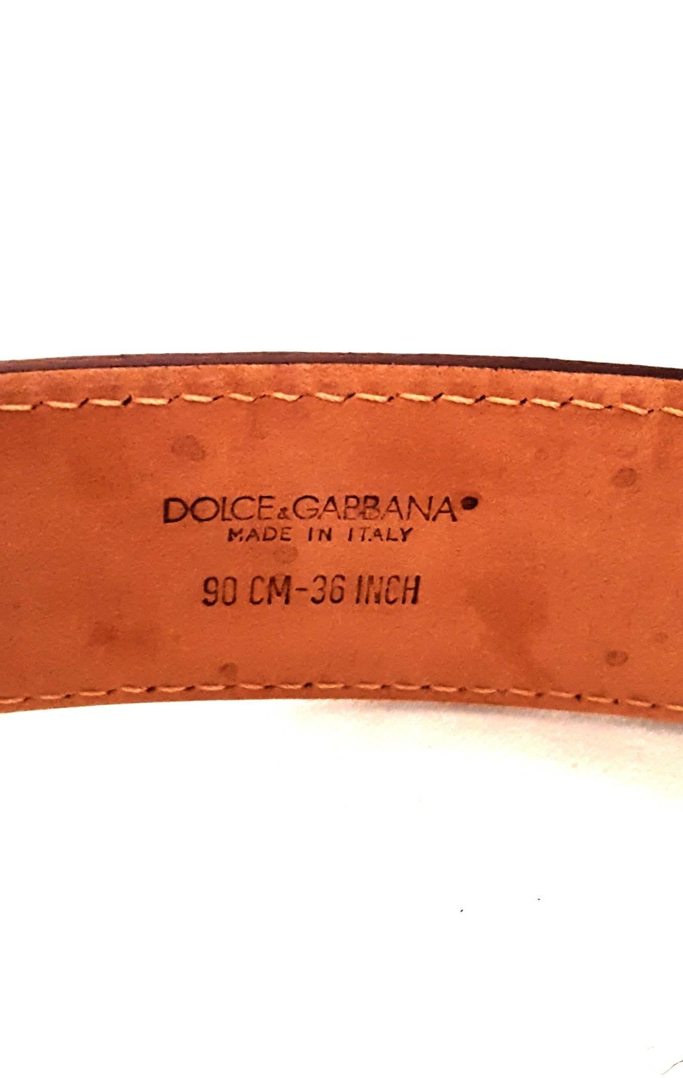 Dolce & Gabbana’s luxurious leather belts are crafted in Italy from the finest artisan techniques.  This black pebbled leather belt with bold D & G silver tone metal logo and silver tone buckle echoes the designs that Dolce & Gabbana have inspired