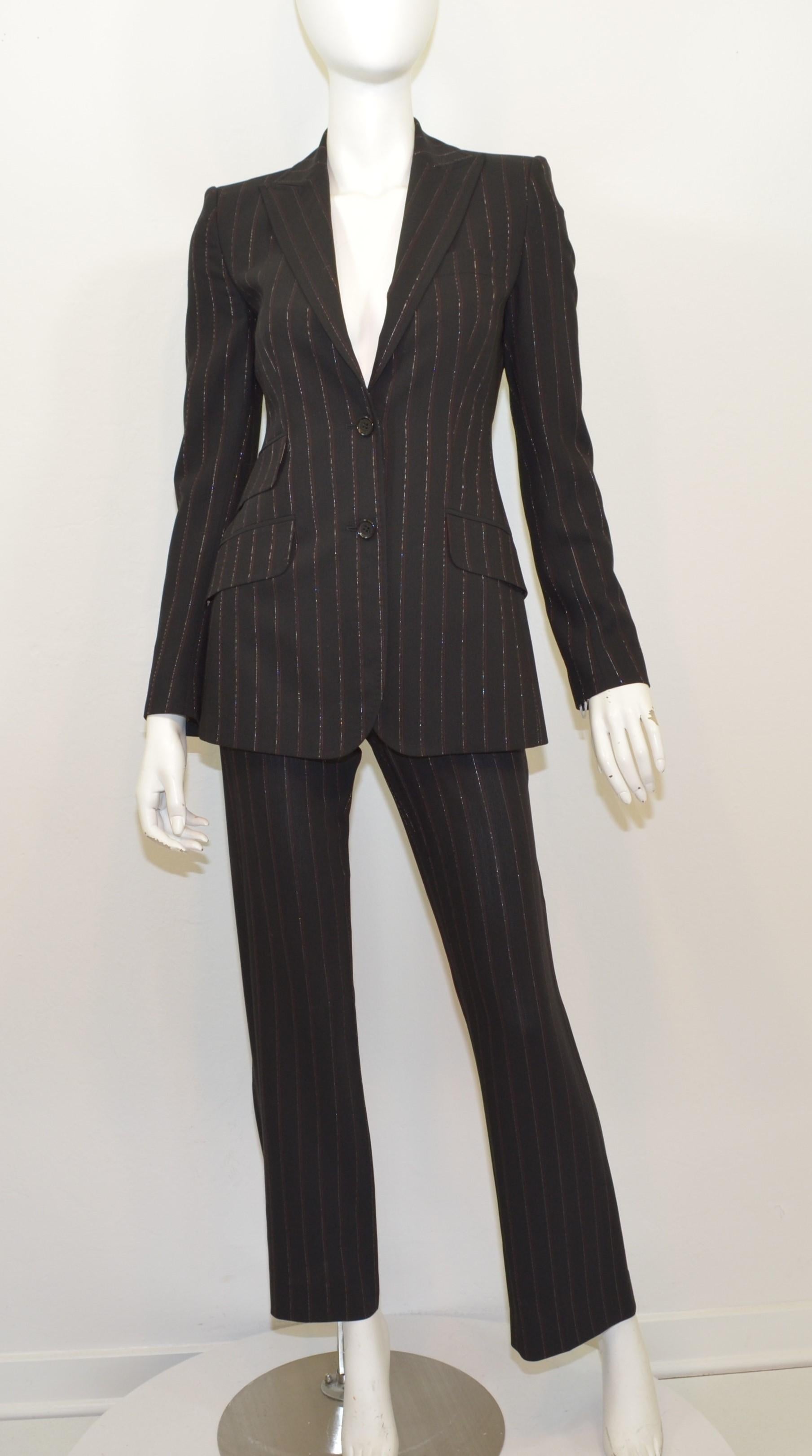 Dolce & Gabbana Black Pinstriped Jacket and Pants Suit Set -- featured in black with silver and red metallic pinstripes throughout. Jacket has button fastenings and three flap pockets. Pants have a button and zipper fastening. Made in Italy, labeled