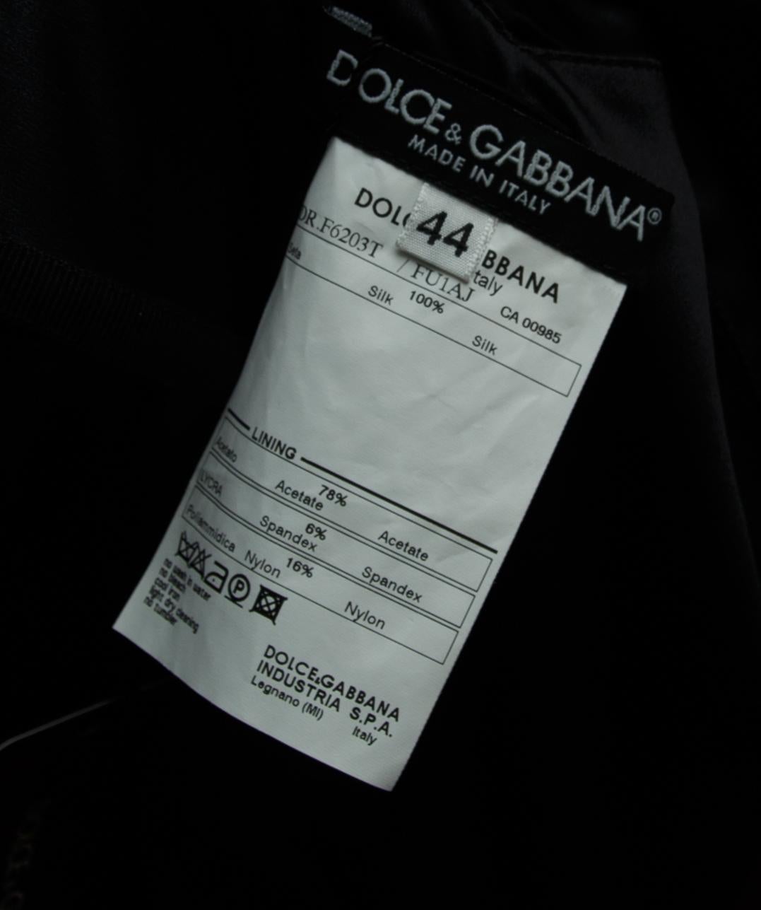 Product details:  Black pleated corseted gown by Dolce & Gabbana.  Scoopneck.  Sleeveless.  Corseted bodice.  Bow accents waist.  Concealed closure.  Label size IT 44.  30