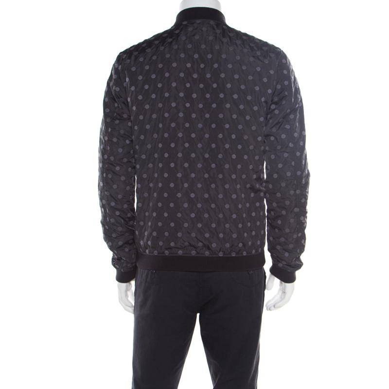 Step out in style in this fabulous bomber jacket from Dolce & Gabbana! The black creation features an embroidered polka dot design and comes with a front zip fastening and long sleeves. It flaunts dual zip pockets on the front and is sure to lend