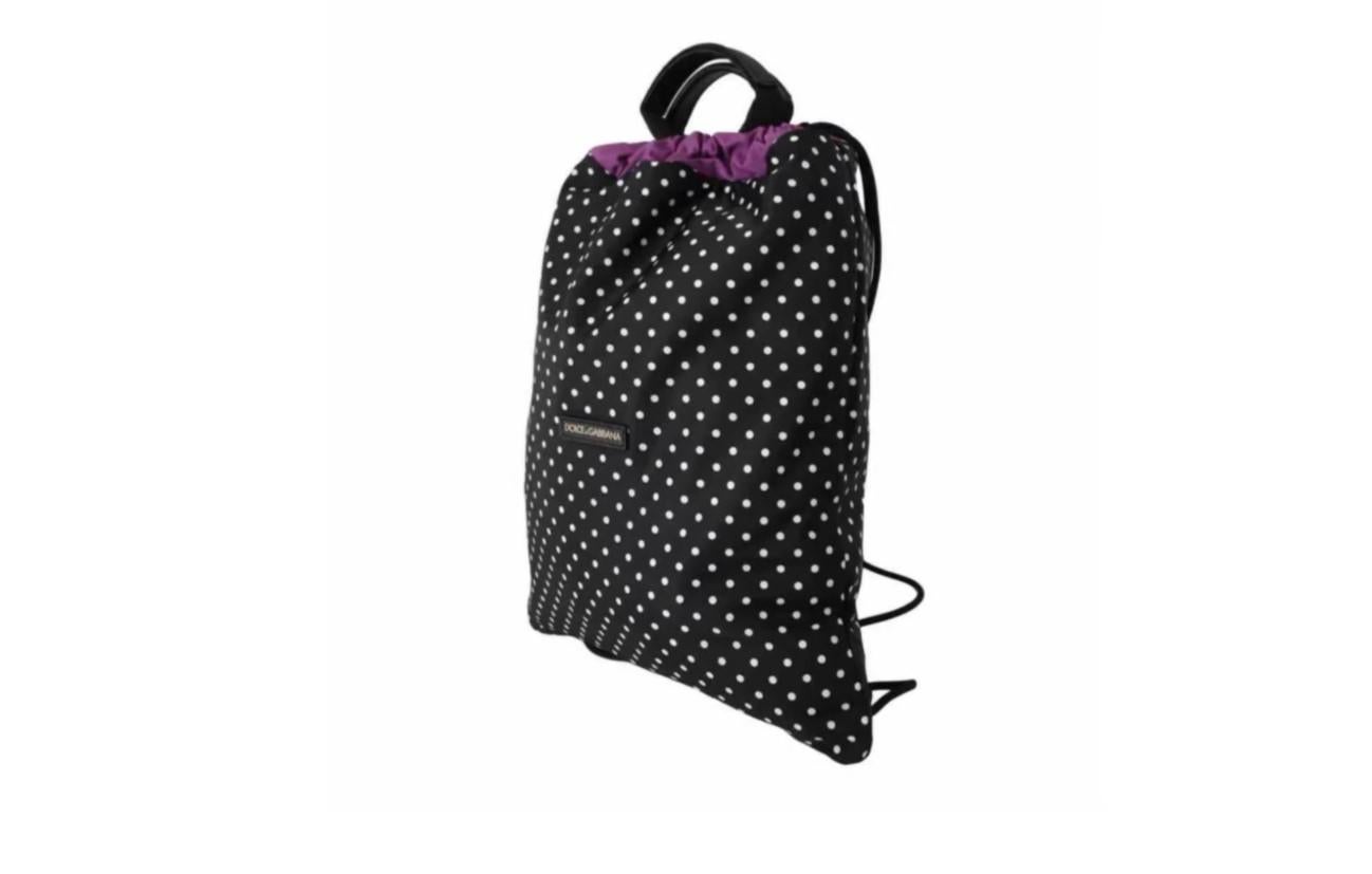 Absolutely Gorgeous, 100%
Authentic, Brand New with Tags Dolce
& Gabbana Ladies Bag

Material: 90% NY 10% Calfskin
Color: Nap Backpack at black polka
dots

Shoulder strap: Adjustable cord
Drawstring closure

Interior pockets with purple lining
Logo