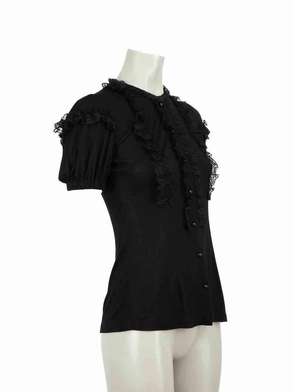 CONDITION is Very good. Hardly any visible wear to top is evident on this used Dolce & Gabbana designer resale item.
 
Details
Black
Viscose
Puff sleeves blouse
Stretchy
Front button up closure
Lace ruffle trim accent
 
Made in Romania
