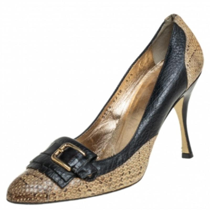 Dolce & Gabbana's timeless aesthetic and stellar craftsmanship in shoemaking is evident in these stunning pumps. Crafted from python and leather in black and beige shades, these pumps are adorned with buckles and fringes. (NOTE: AVAILABLE FOR UAE