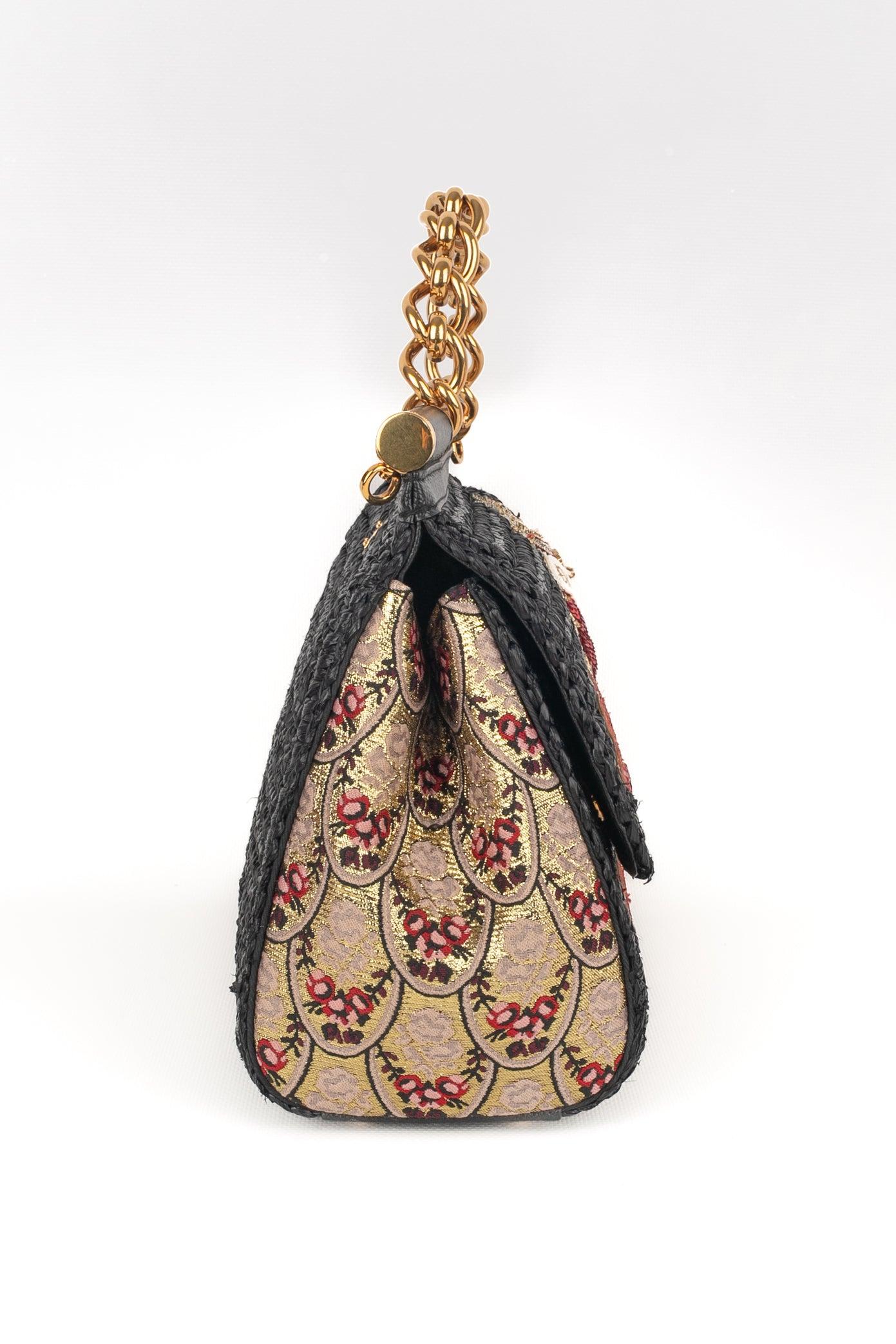 Dolce & Gabbana - (Made in Italy) Black raffia handbag with leather and fabric embroidered with golden lurex threads. Golden metal chain handle. 2018 Spring-Summer Collection.

Additional information:
Condition: Very good condition
Dimensions: