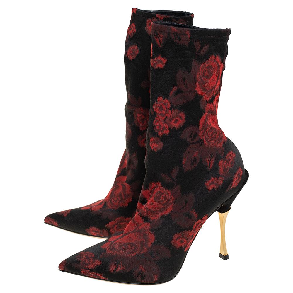 Dolce & Gabbana elevates your style quotient giving you just the right amount of attention with this gorgeous pair of boots. Let this stretch fabric pair of boots with a gold stiletto heel elevate not only your height but most importantly, your