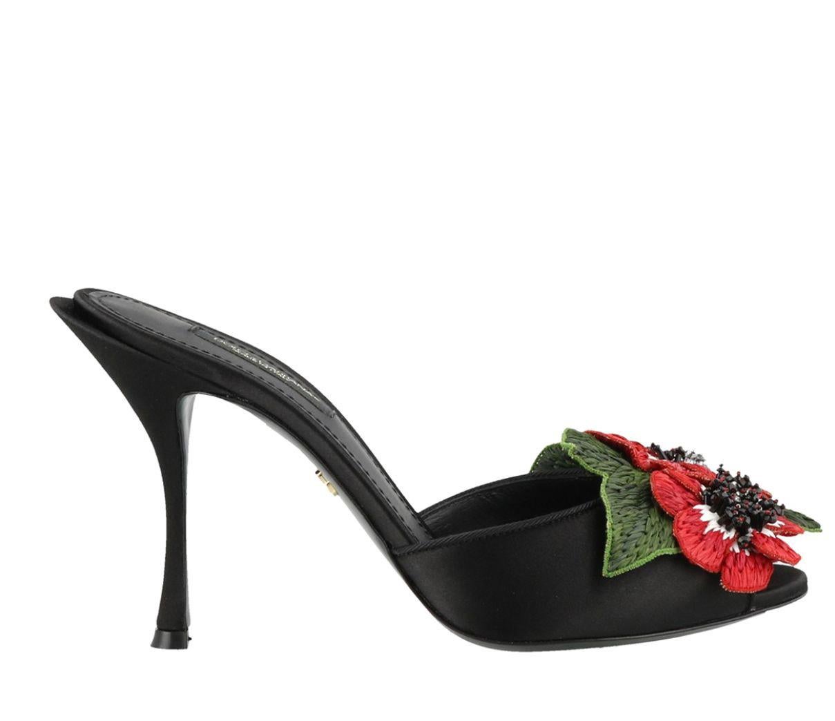 DOLCE & GABBANA 
 
 Superb with tags, 100% genuine Dolce & Gabbana shoes. 
 
 Style: Slip-on Sandals, Peep Toe, Heels 
 Material: 10% Plastic, 2% Glass, 3% Polyester, 20% Silk, 65% Rayon 
 Color: black with red roses on the front 
 black red