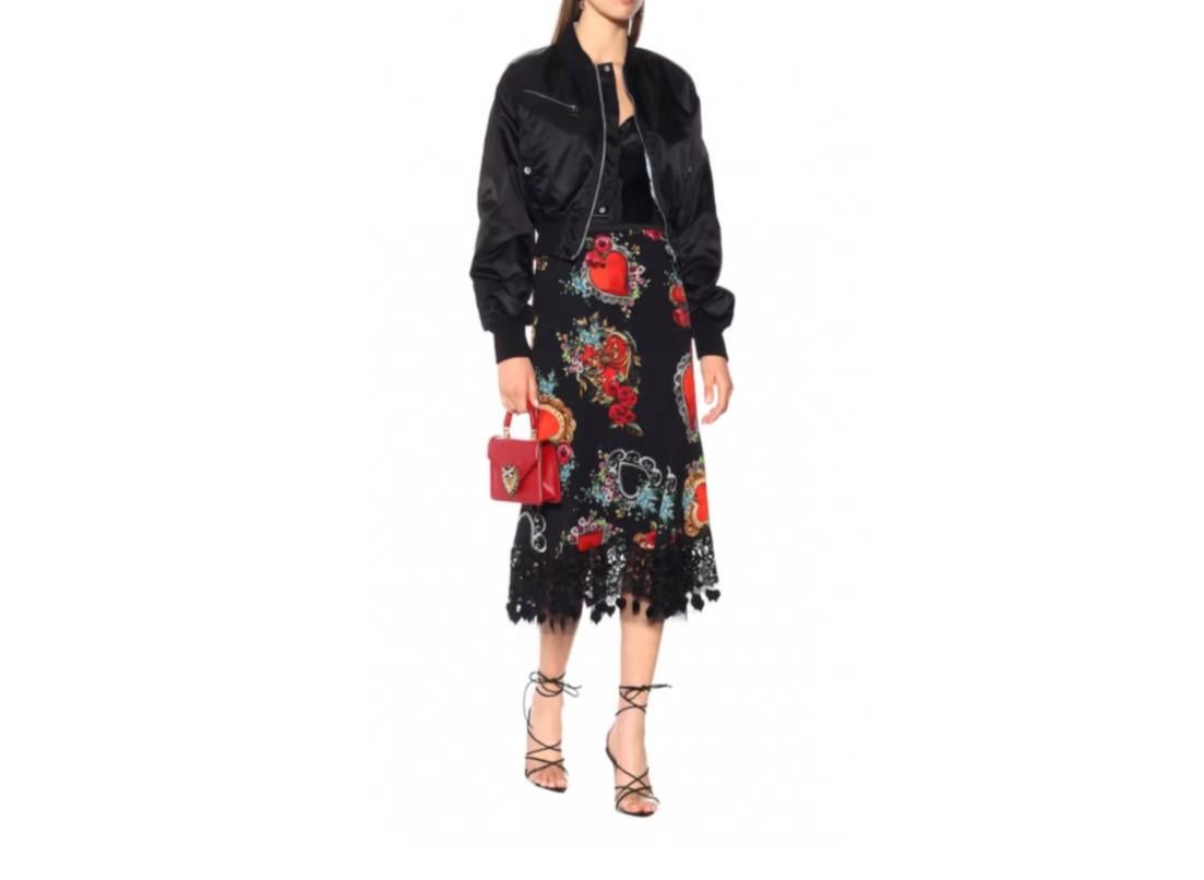 DOLCE & GABBANA SILK MIDI SKIRT WITH HEART AND ROSE PRINT IN BLACK
Runway Collection represents the evolution of Dolce&Gabbana’s heritage towards a perfect blend of tradition and innovation. Stretch silk charmeuse Godet skirt with a heart and rose