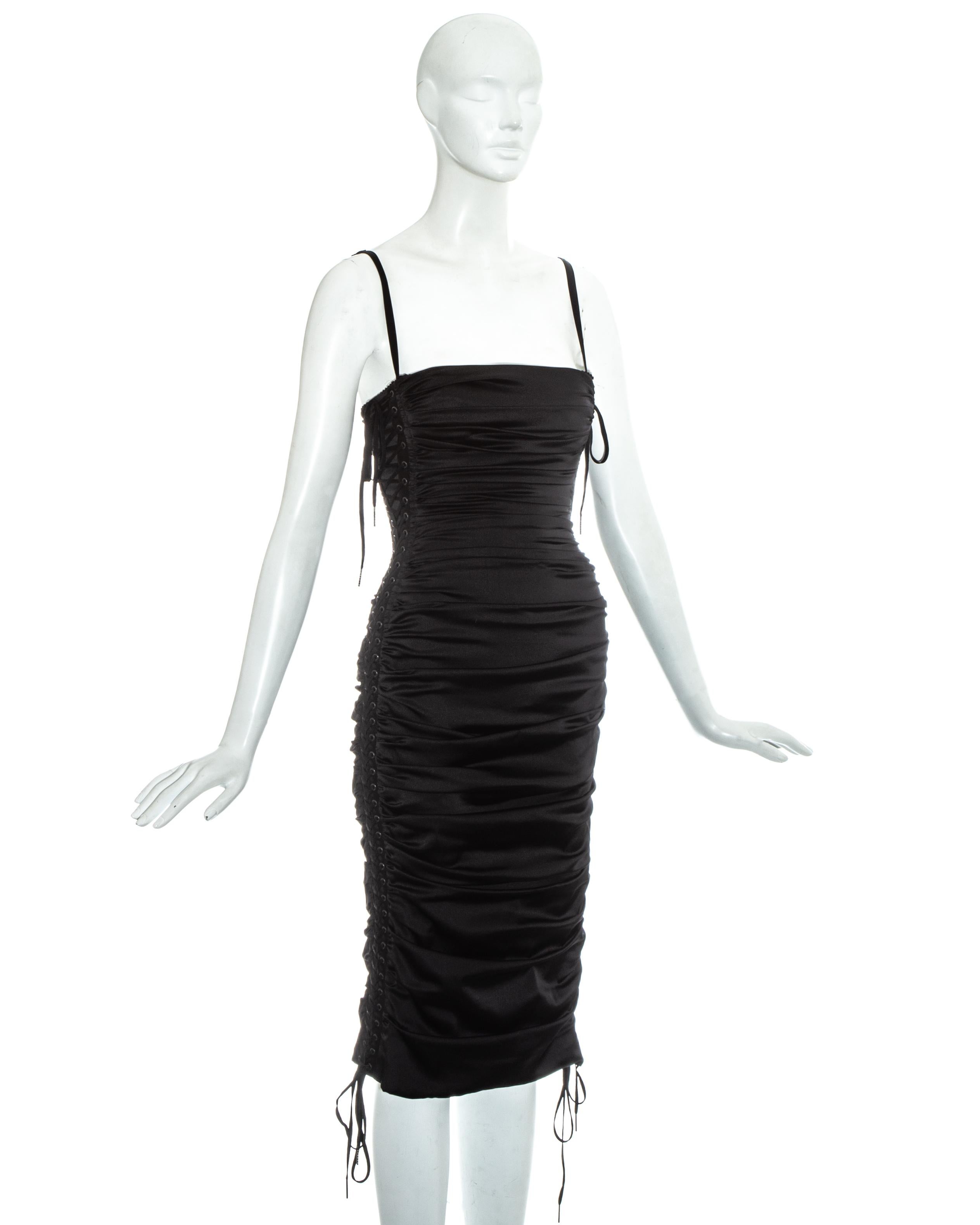 Dolce & Gabbana black ruched silk figure hugging mid-length evening dress with lace up fastenings on side panels and built in satin bra with adjustable shoulder straps

Spring-Summer 2003