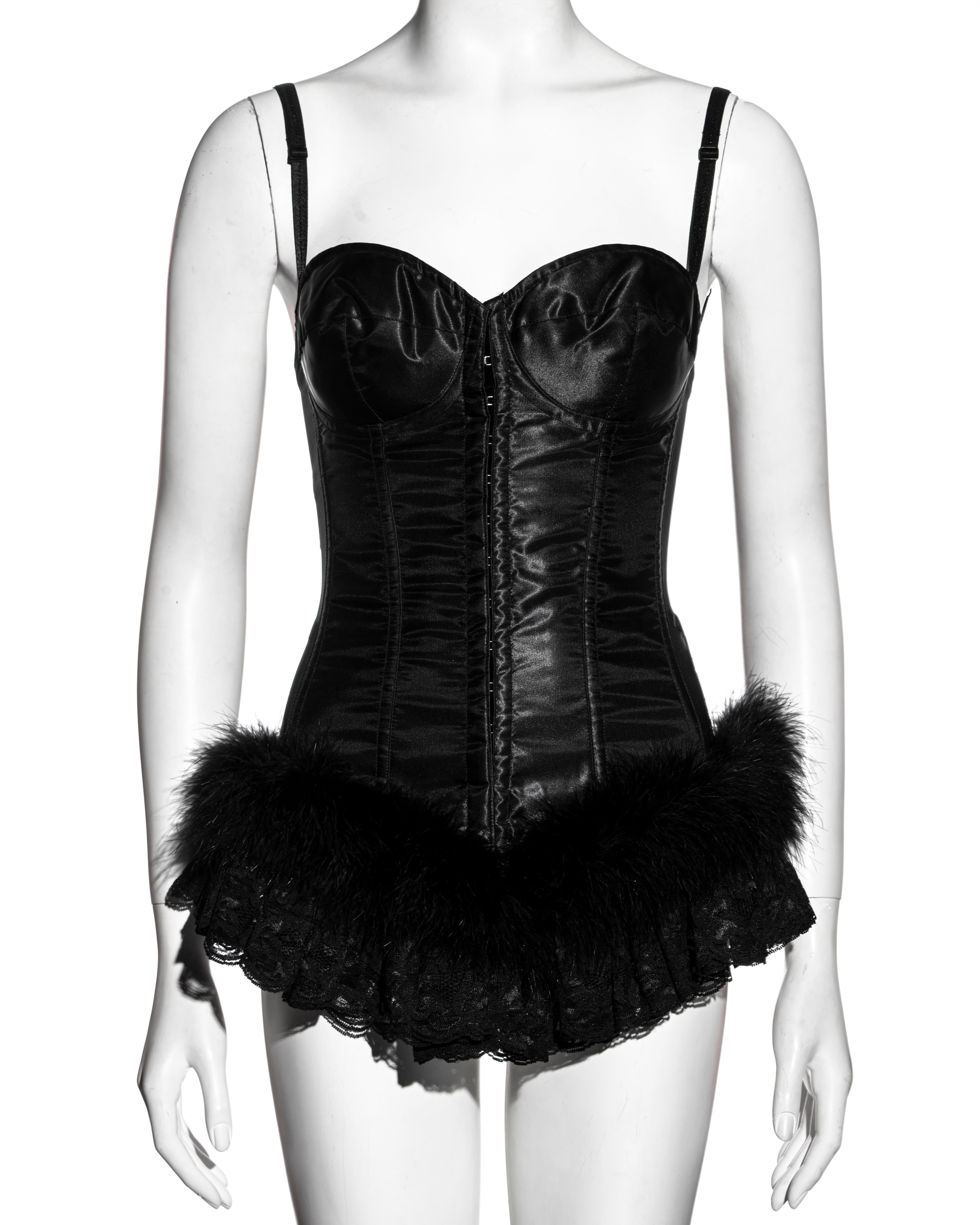 ▪ Dolce & Gabbana black black corset
▪ Overwire bra 
▪ Corseted bodice 
▪ Metal hook fastenings down the center front 
▪ Spandex mesh side and back panel
▪ Marabou feather and lace ruffled trim at the hem 
▪ Adjustable shoulder straps 
▪ IT 42 - FR