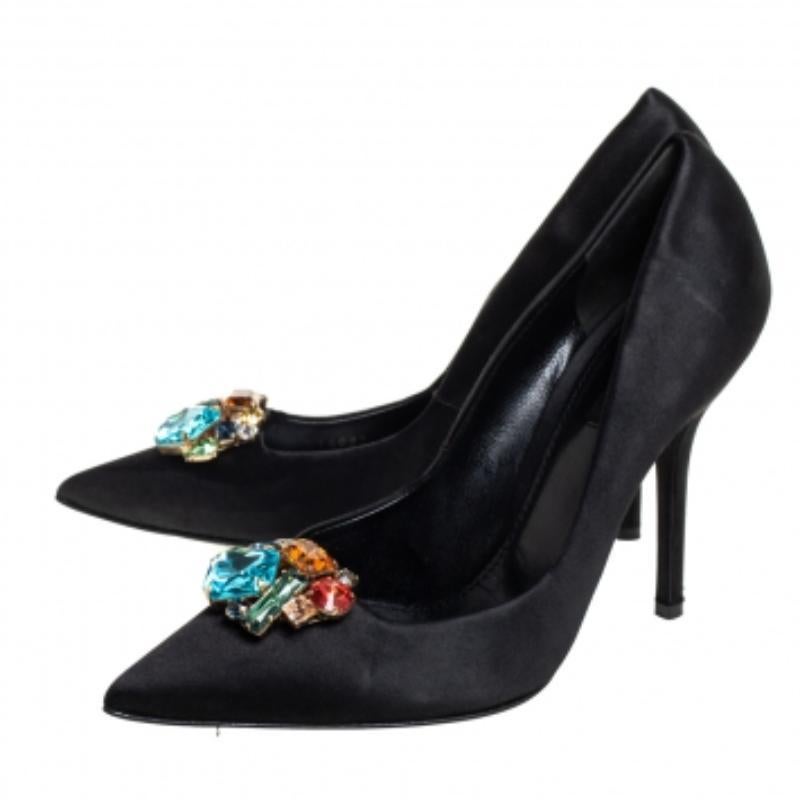 Dolce & Gabbana is well-known for its graceful designs, and its label is synonymous with opulence, femininity, and elegance. These pumps are crafted from satin into a pointed toe silhouette augmented by the embellishments perched on the uppers. They
