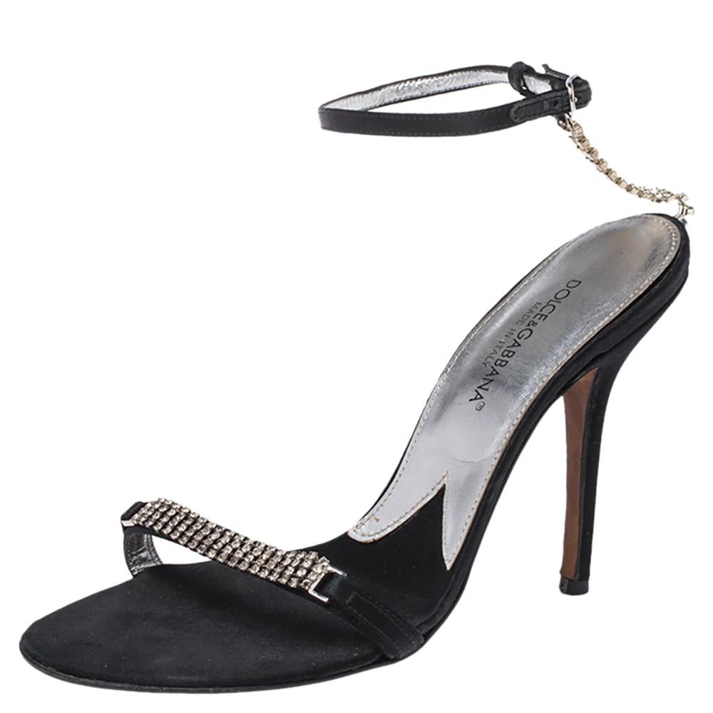 Dolce & Gabbana brings forth a classic style to add to your footwear collection. This pair of stilettos are adorned with sparkling crystals that add a hint of panache to your ensemble. Easily paired with your evening attire, these black satin