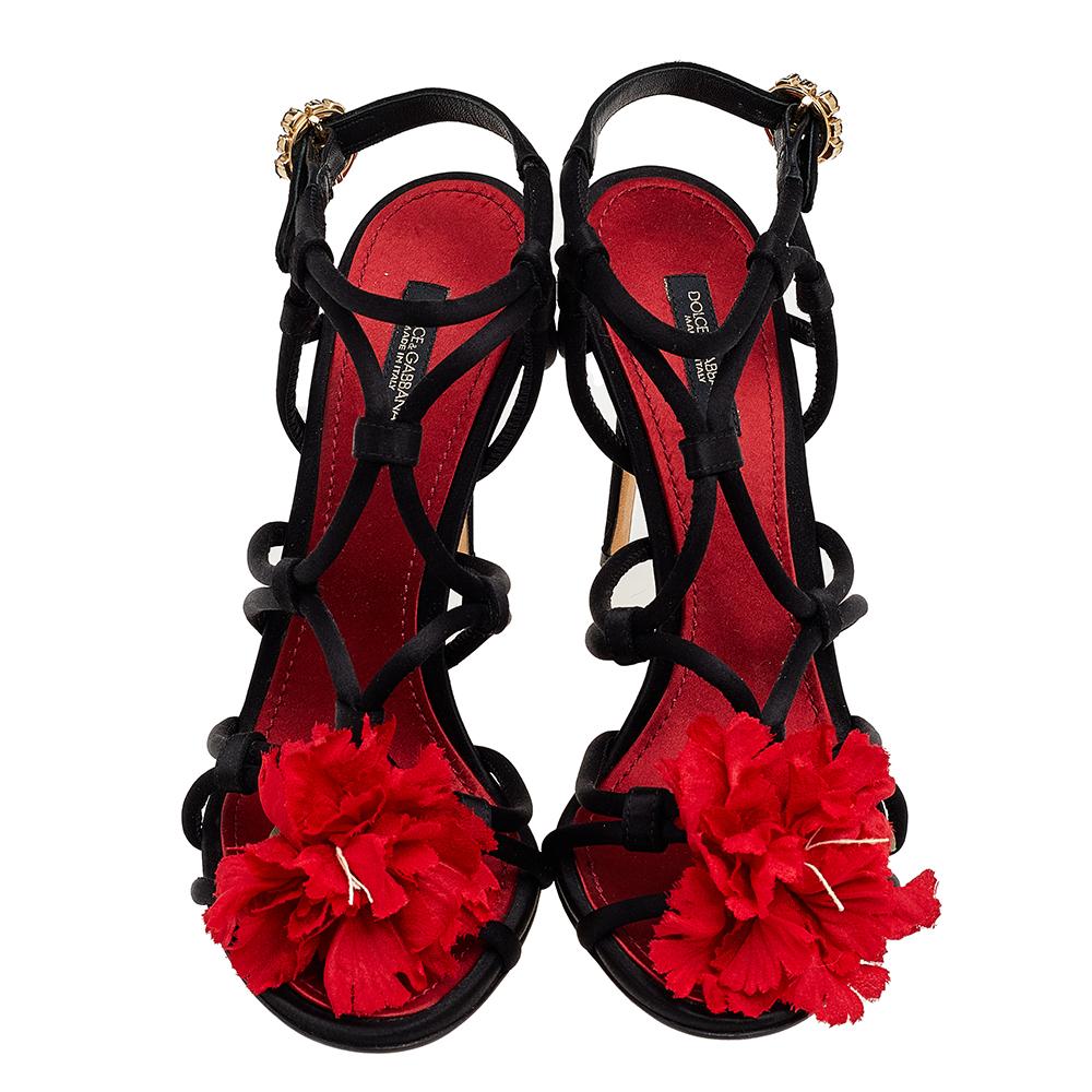 Intricately designed to offer feminine style and gracefulness, these sandals from Dolce & Gabbana are indeed a beauty to behold! They are made using black satin and enriched with a red floral applique on the straps, a crystal-embellished buckle