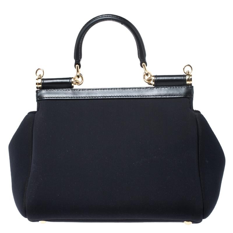 This gorgeous black Miss Sicily bag from Dolce & Gabbana is a handbag coveted by women around the world. It has a well-designed satin body and a flap that opens to a compartment with fabric lining and enough space to fit your essentials. The bag