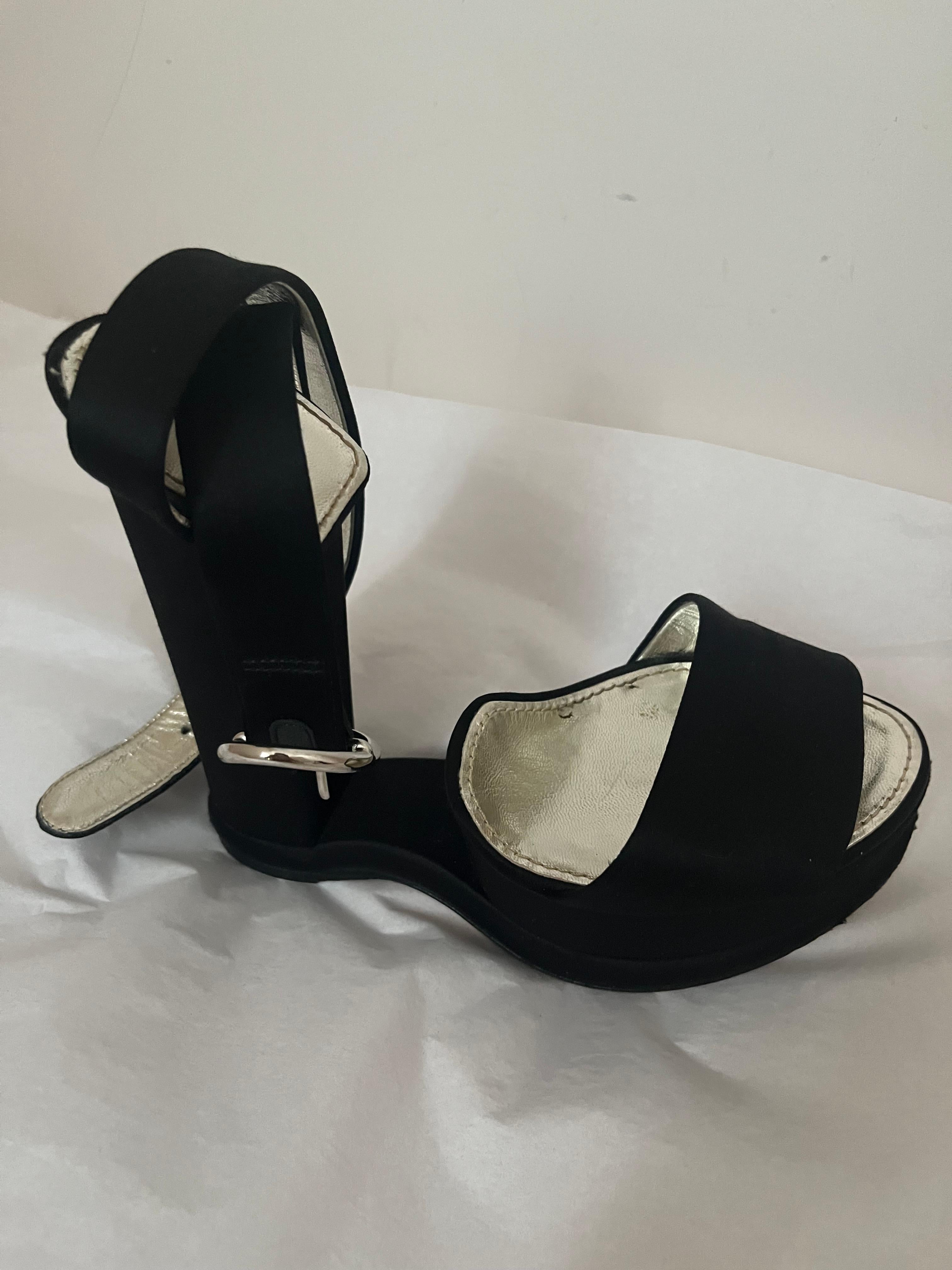 What is special about this black satin with the ankle strap and peep toe is of course the inverted heel. The molded sole gives you the almost flat feel, but wear them and you are wearing heels (6