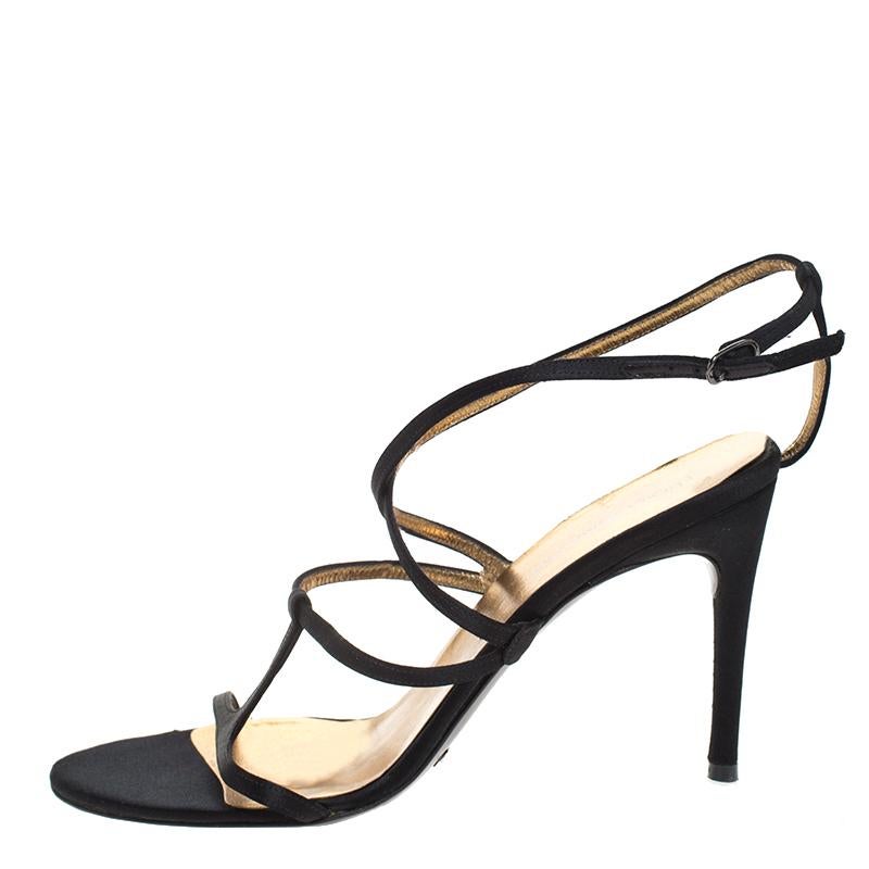 These sandals from Dolce & Gabbana will lend an elegant edge to your feet. Look your best as you step out in these satin sandals that come in a strappy design. The black beauties are elevated on 9 cm heels.

