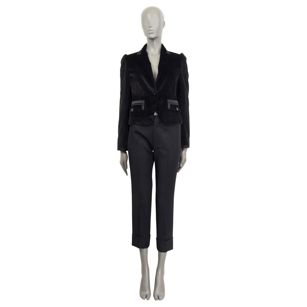 100% authentic Dolce & Gabbana velvet tuxedo jacket in black cotton (87%), silk (8%), polyester (3%) and spandex (2%). Features buttoned cuffs, two buttoned flap pockets on the front and one sewn shut chest pocket. Opens with one button on the