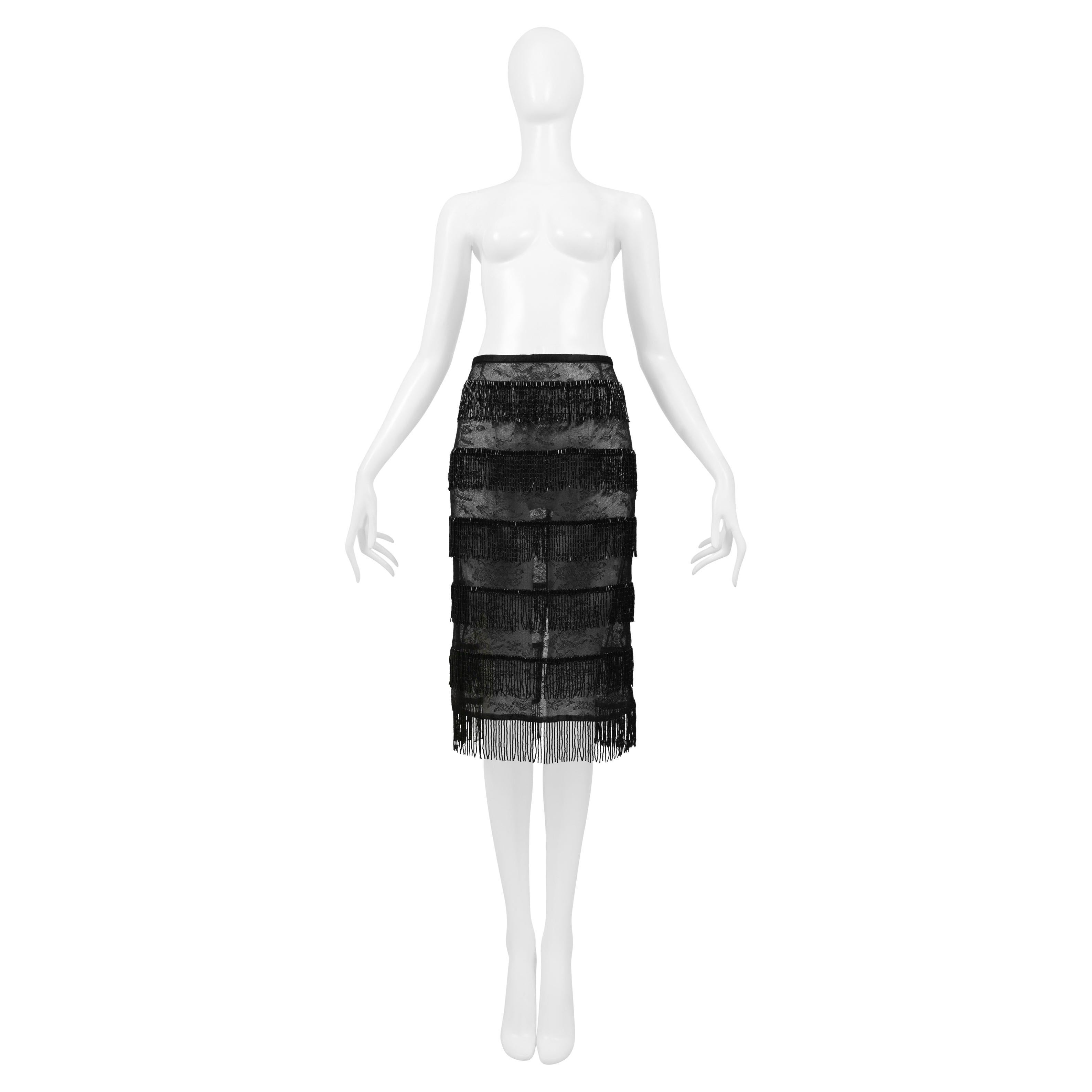 Resurrection Vintage is excited to offer a vintage Dolce & Gabbana black skirt featuring beaded fringe throughout, sheer lace, and an invisible back zipper.
* Dolce & Gabbana
* Size IT 42
*  Fabric: 50% Viscose, 50% Nylon
* 2000 SS Collection
*
