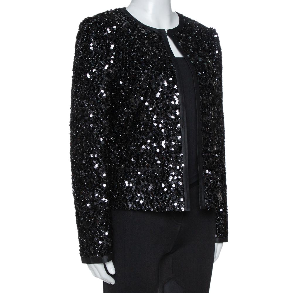 Designed in the most stunning and classic black sequin embellishment, this stunning Dolce & Gabbana jacket is a perfect party piece. Featuring a silk lining, this glamorous creation also features hook details along the front, long sleeves and a good