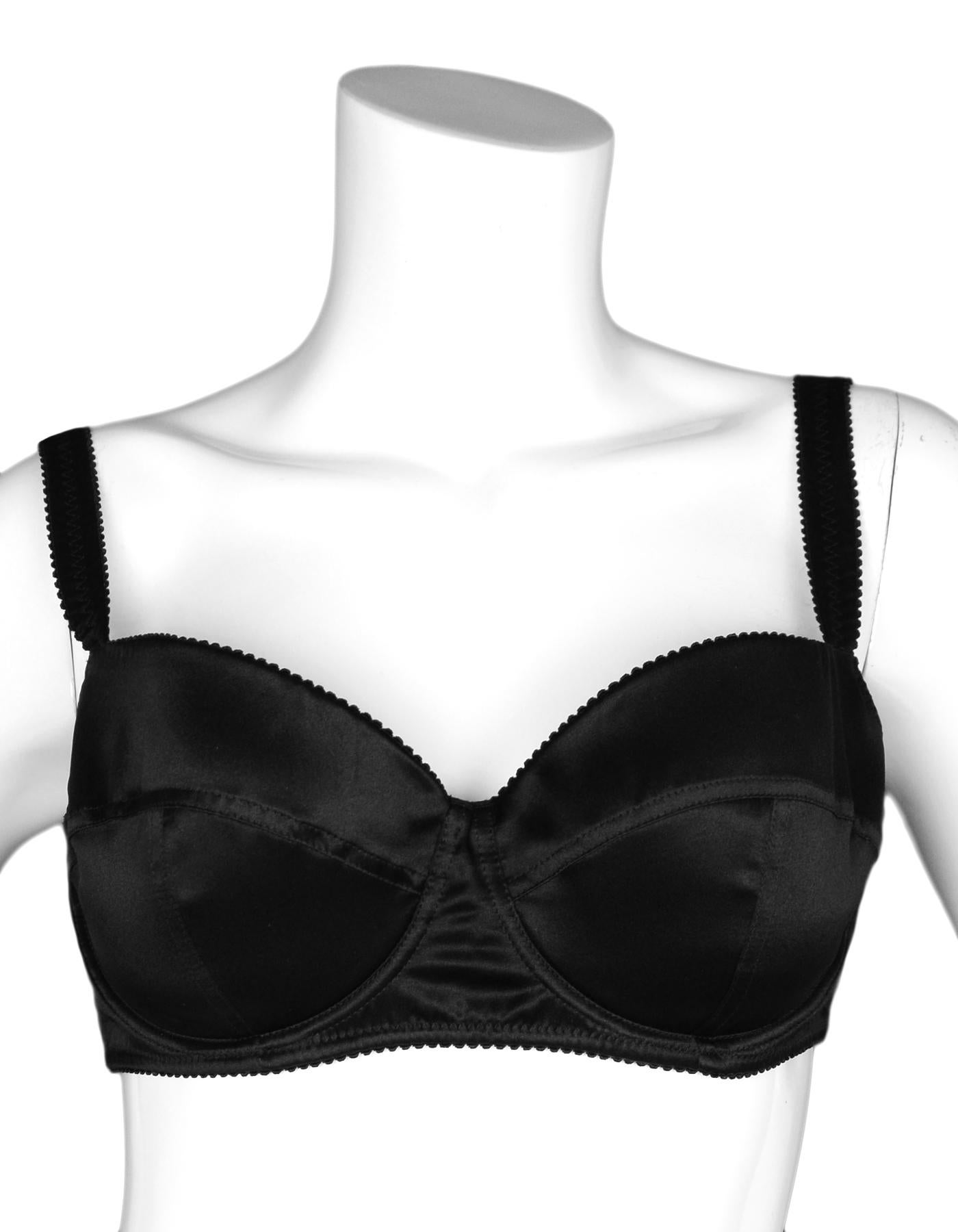 Dolce & Gabbana Black Silk/Satin Bra 40B

Made In: Italy
Color: Black
Materials:  94% silk, 6% spandex
Padding: 66% polyester, 34% polyurethane 
Opening/Closure: Three rows of two clasps 
Overall Condition: Excellent pre-owned condition