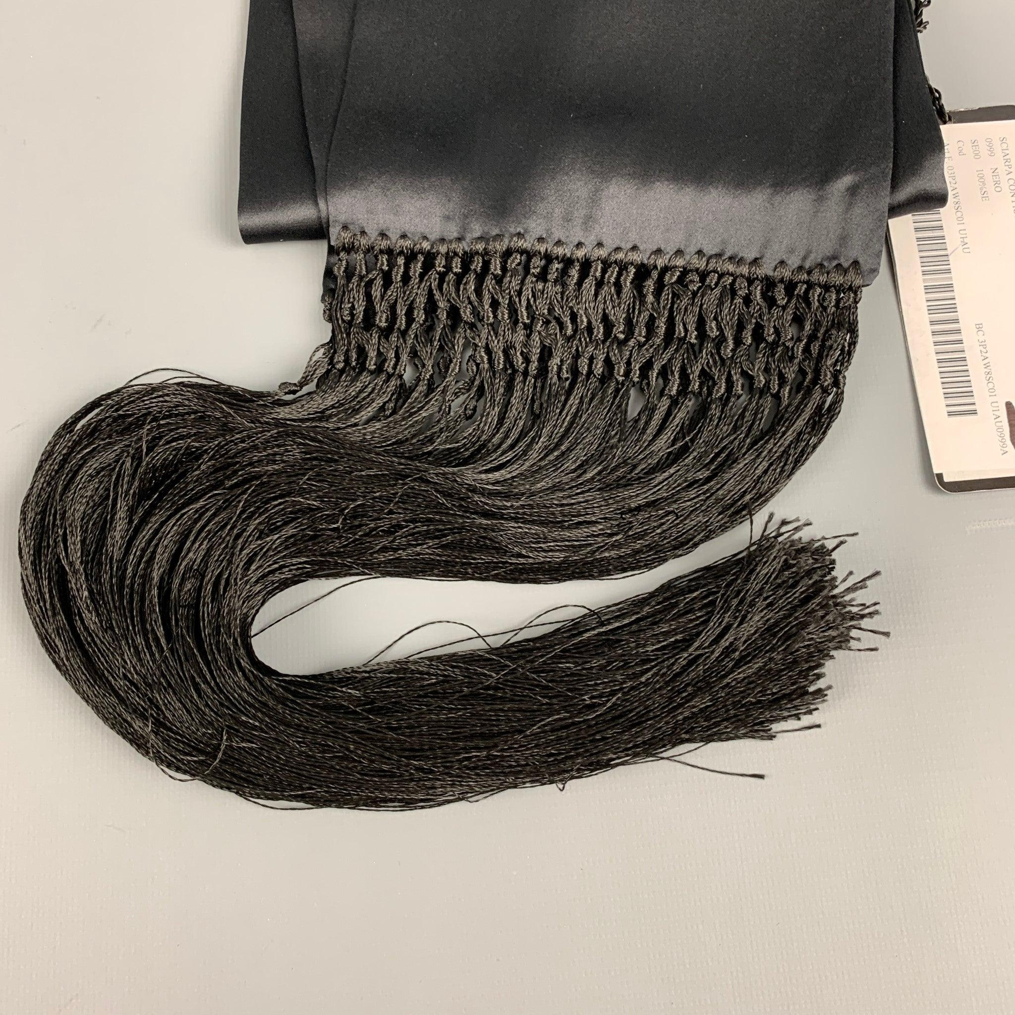 DOLCE & GABBANA scarf comes in a black silk satin material featuring a fifteen inch fringe trim.New with Tags. 

Measurements: 
  
6 inches  x 66 inches  

  
  
 
Reference: 126923
Category: Scarves & Shawls
More Details
    
Brand:  DOLCE &