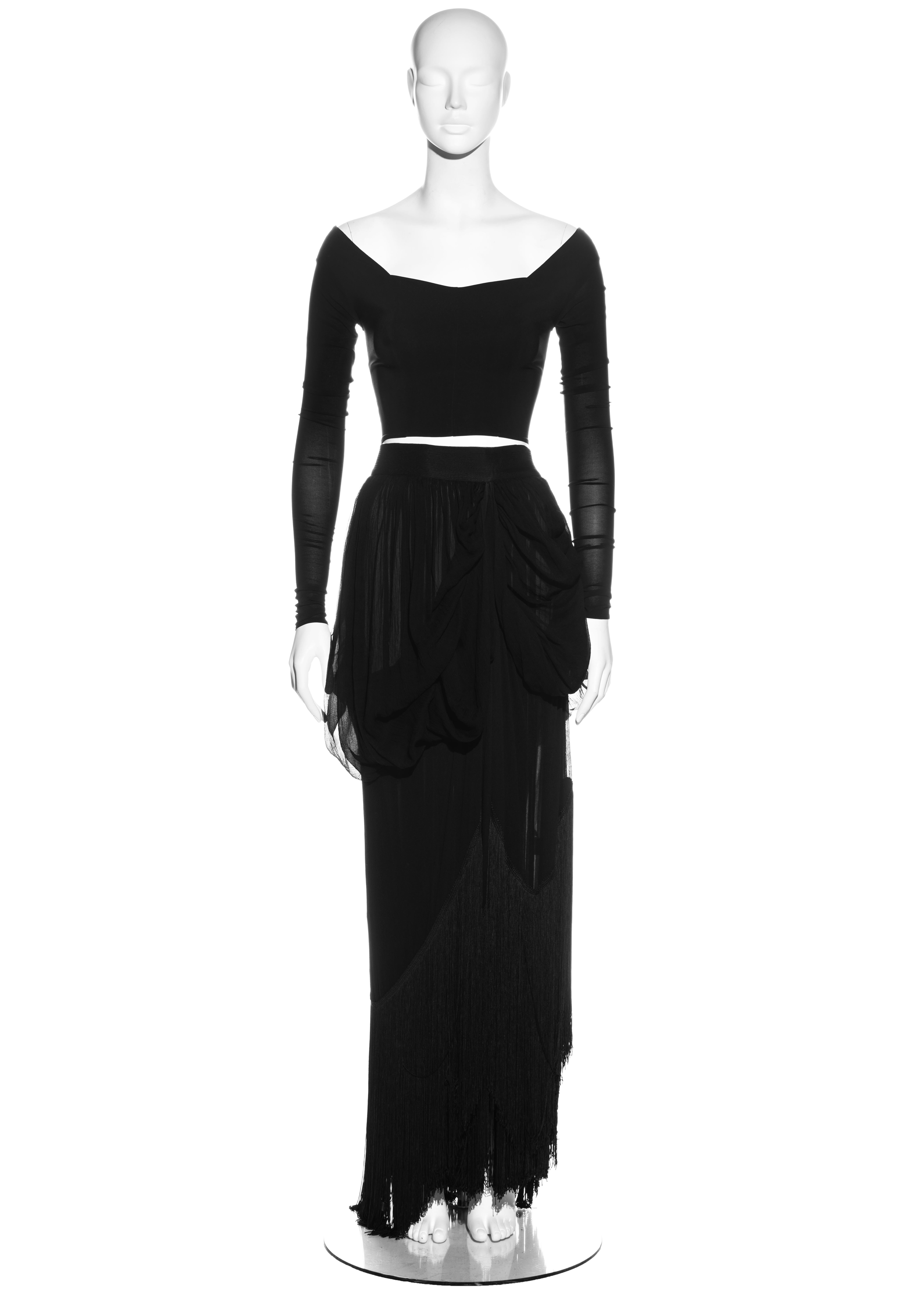 ▪ Dolce & Gabbana black skirt and top set
▪ 100% Silk
▪ Fitted long sleeve top 
▪ Maxi bustled skirt 
▪ Long fringed trim around hemline 
▪ IT 40 - FR 36 - UK 8 - US 4
▪ Fall-Winter 1993